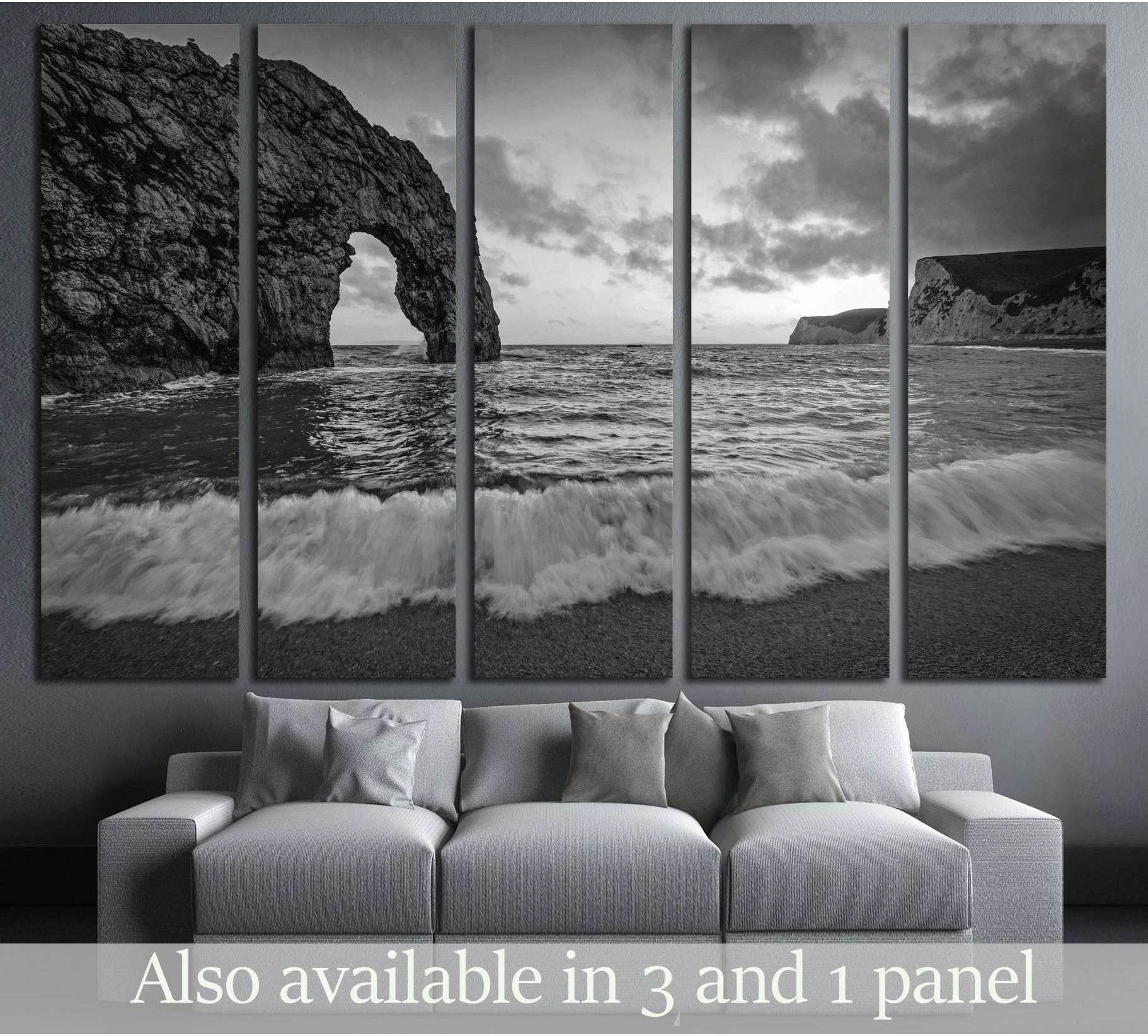 Durdle Door on the Jurassic coast of Dorset with crashing wave in Black and White showing ocean water, wave movement and surf.