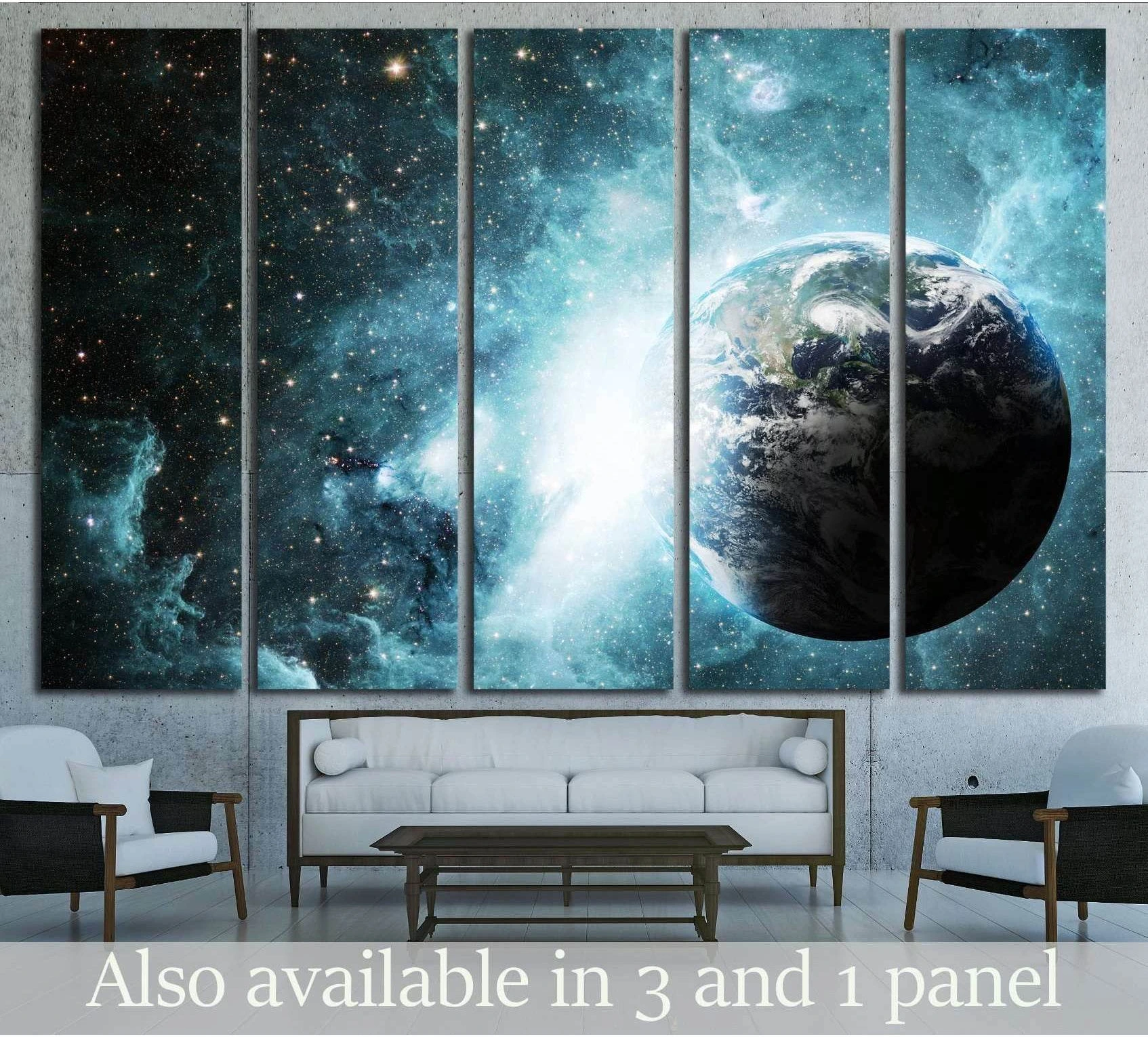 Multi-panel Earth from space canvas print with blue nebula and stars above sofa in modern living room