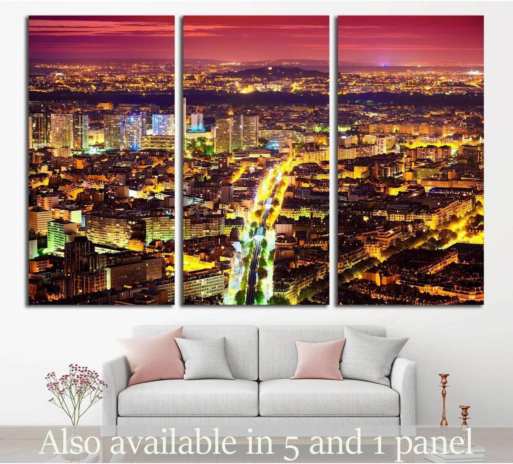 Paris night cityscape triptych canvas print above sofa with glowing streets and purple sky