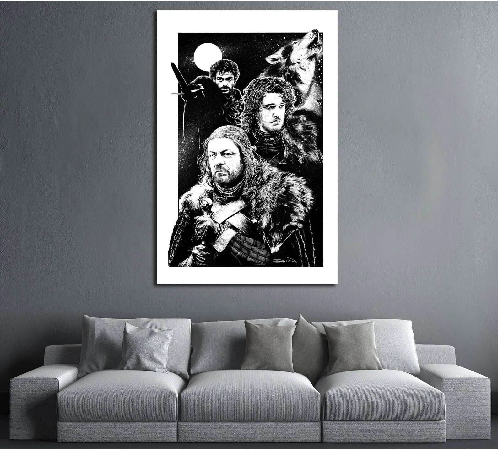 Black and white Eddard Stark canvas print with House Stark figures and direwolf above a gray sofa
