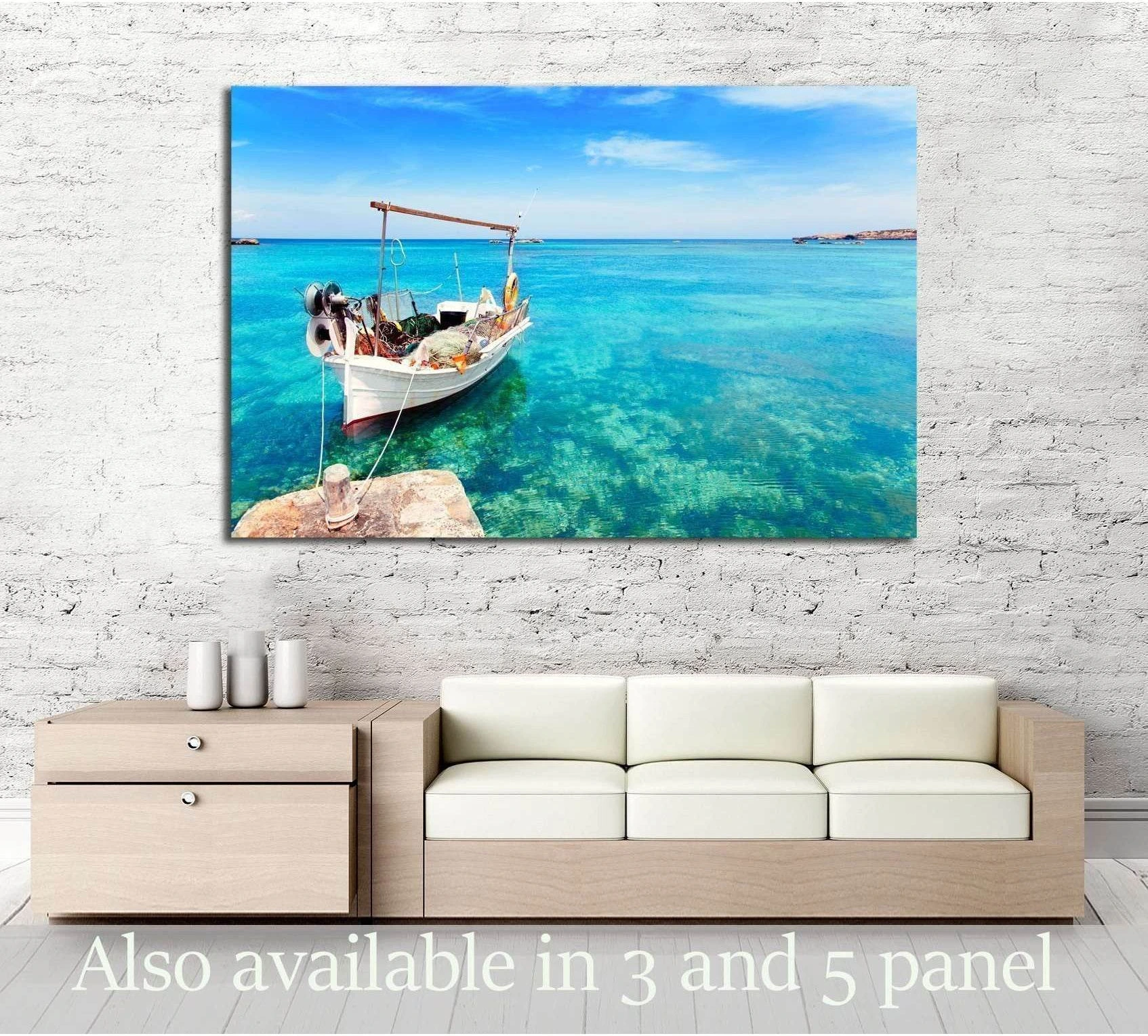 Traditional fishing boat in turquoise Formentera water canvas print above sofa in coastal living room