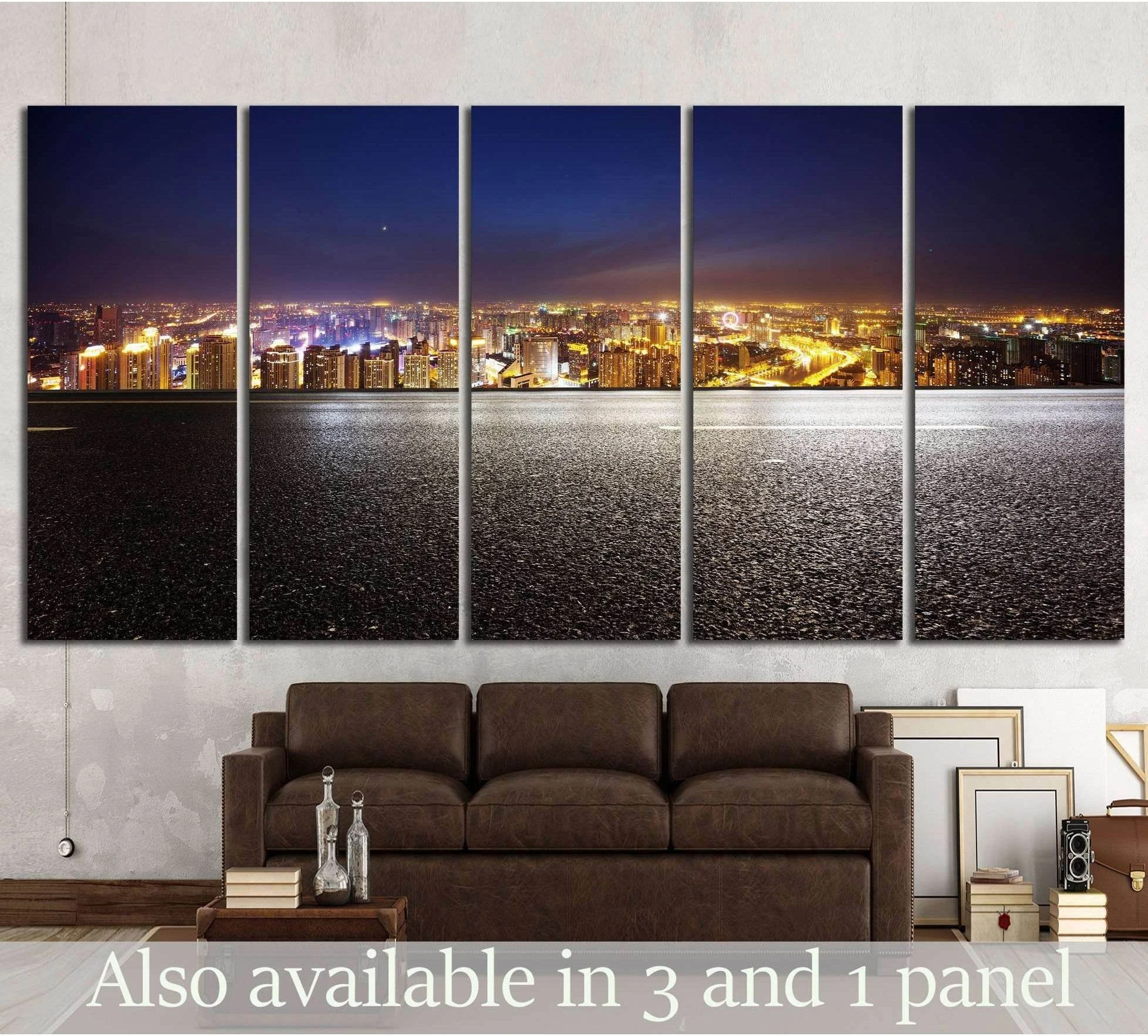 Five-panel night city skyline canvas print above sofa with empty asphalt road foreground