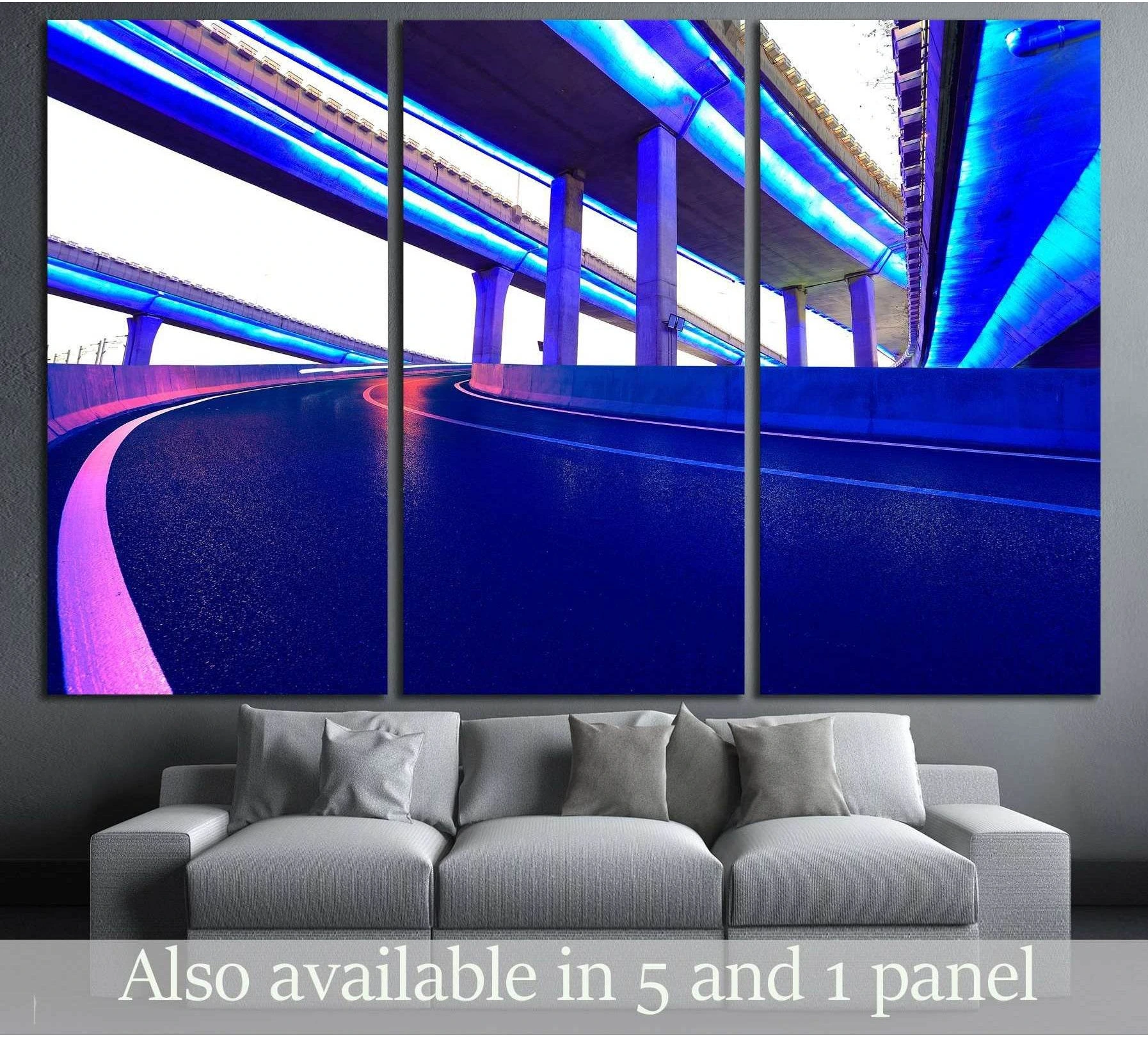 Neon highway overpass canvas print with blue and purple night city lines above a sofa