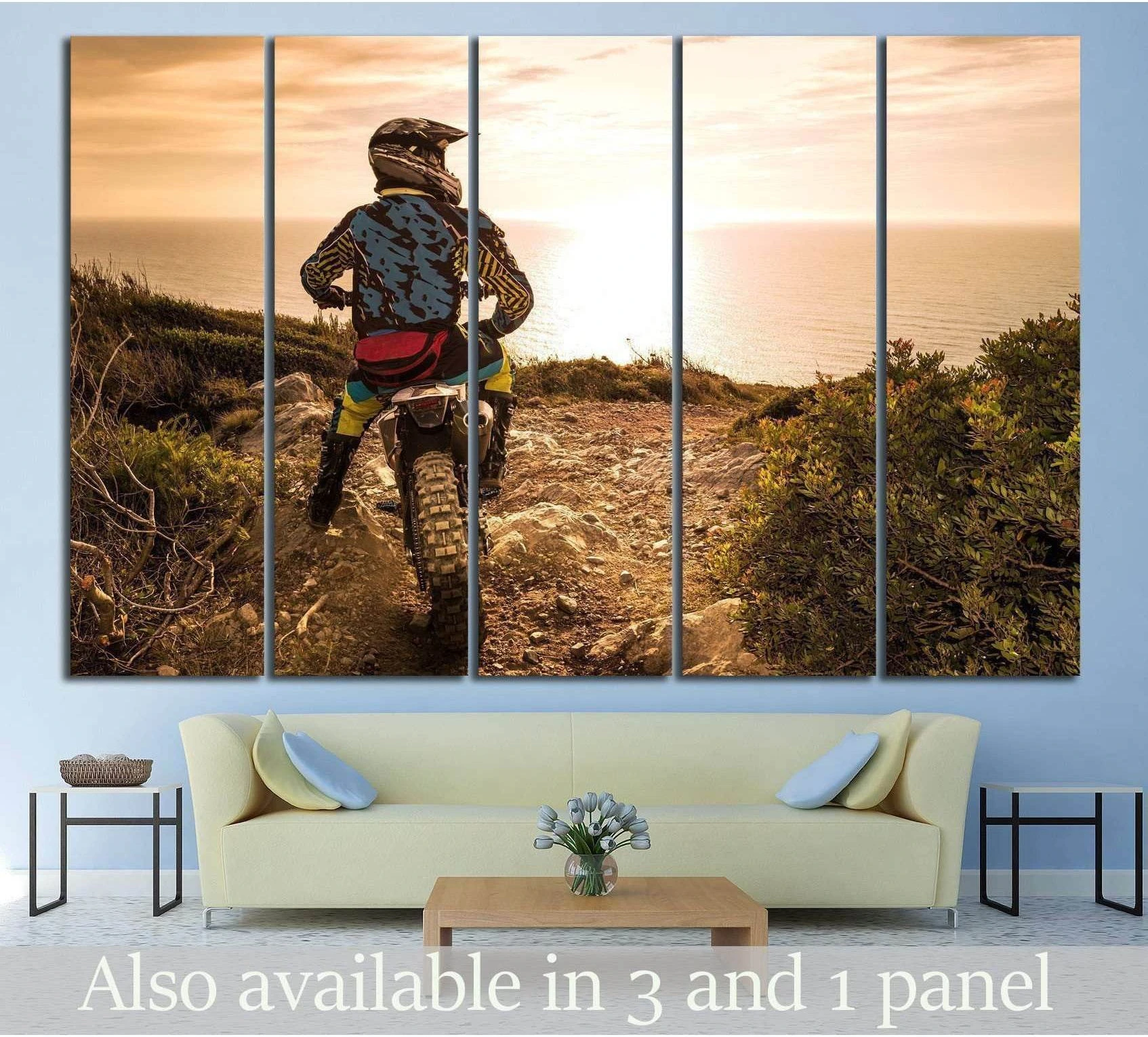 Enduro motorcycle canvas print with rider on a coastal trail at sunset above a sofa
