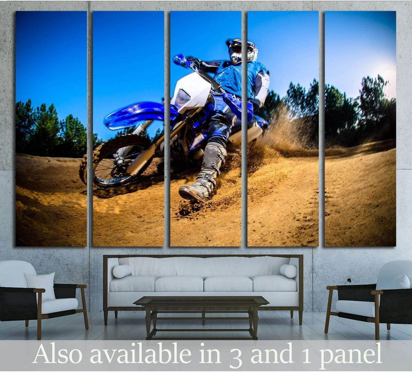 Enduro bike canvas print with rider turning through sand above sofa in modern living room