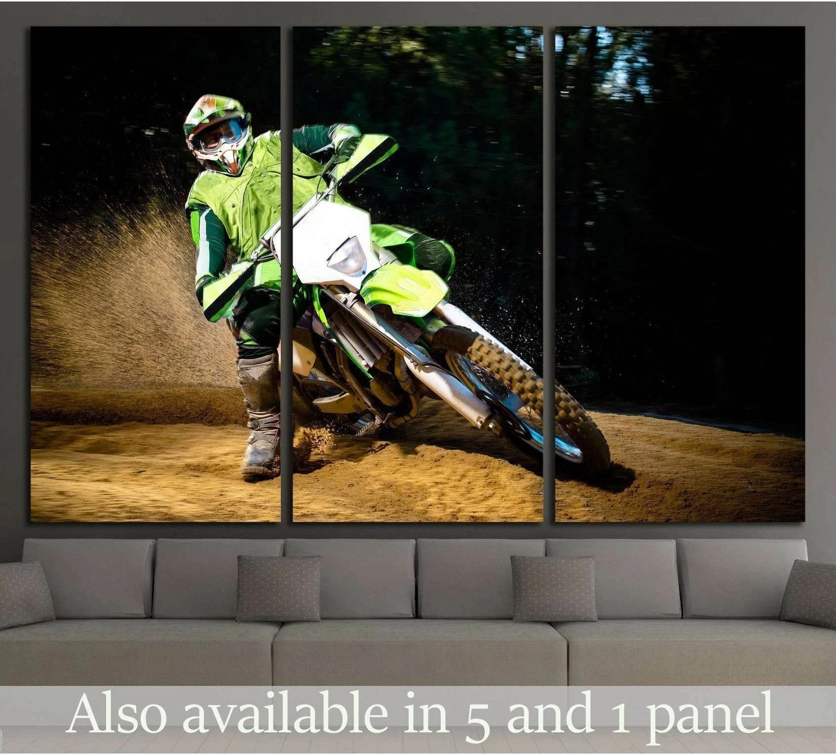 Enduro dirt bike rider canvas print above sofa, leaning through a sandy turn with flying sand