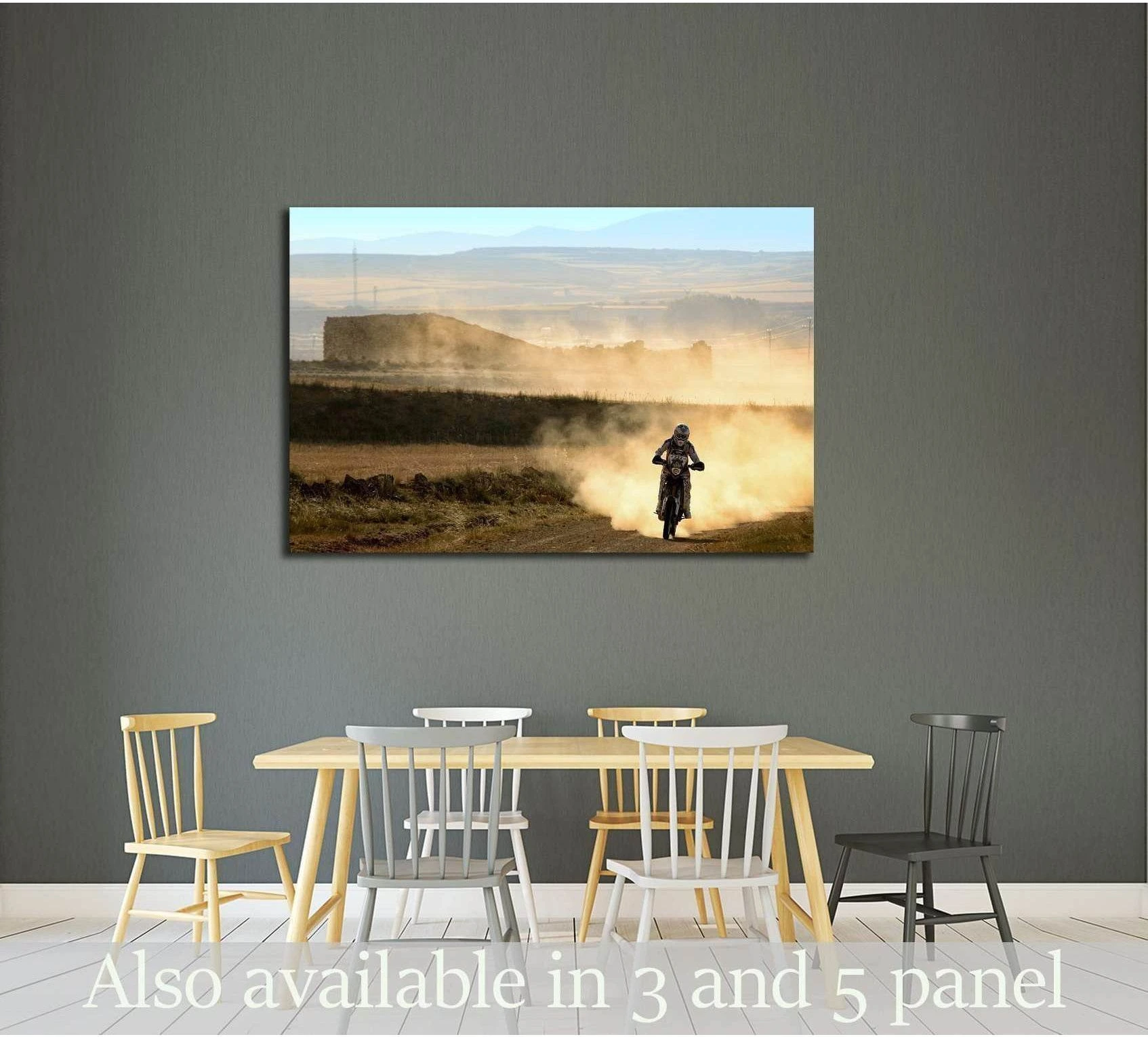 Enduro motorbike canvas print with a lone dirt bike rider in golden dust above a dining table