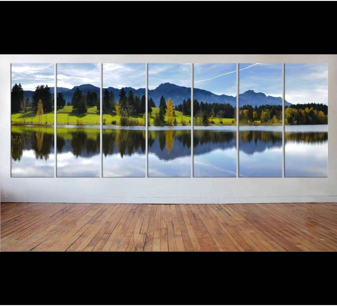Bavaria lake and mountain canvas print with forest reflections in a panoramic living room mockup