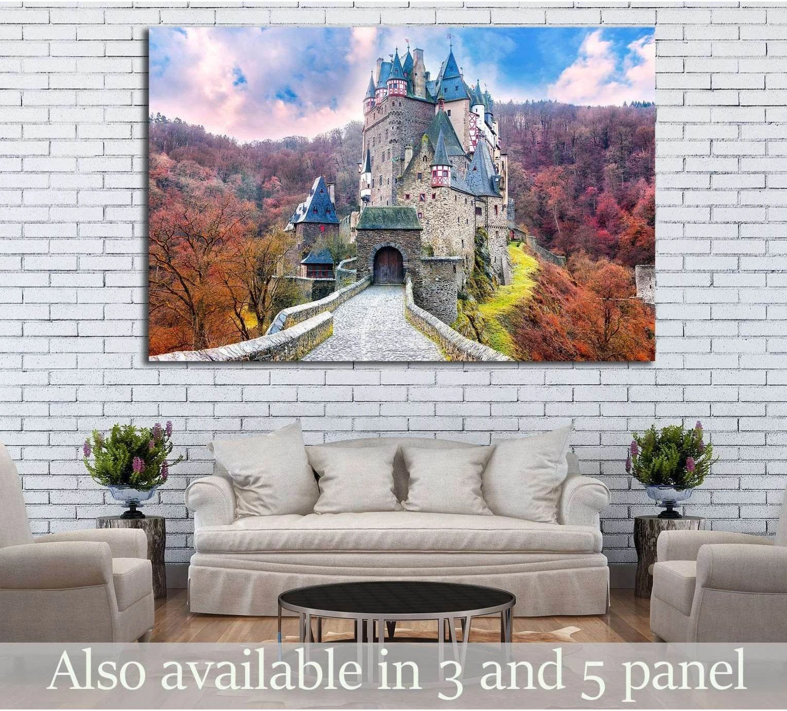 Fairytale castle canvas print above sofa in living room with stone bridge, turrets, and autumn forest