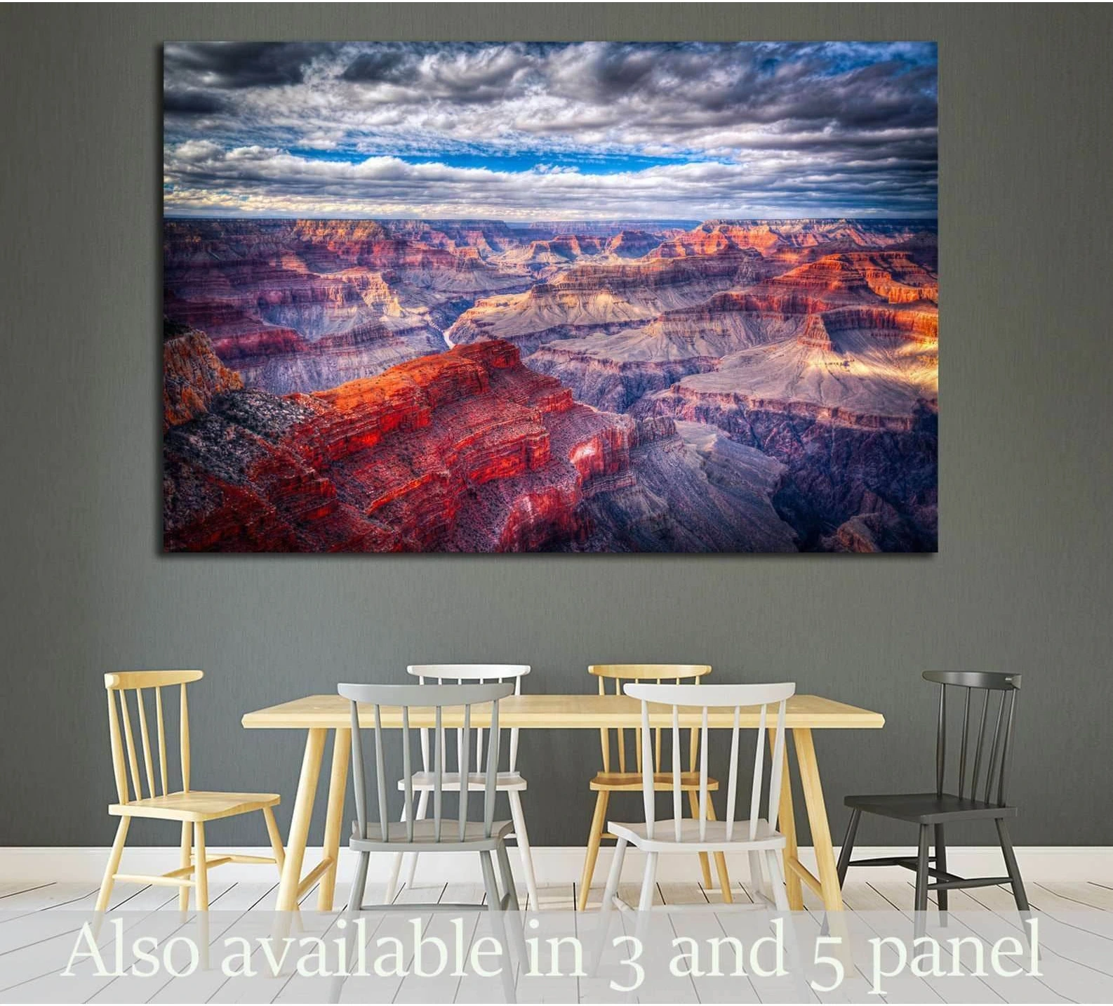 Grand Canyon canvas print with layered red rock cliffs under dramatic clouds, displayed above a dining table