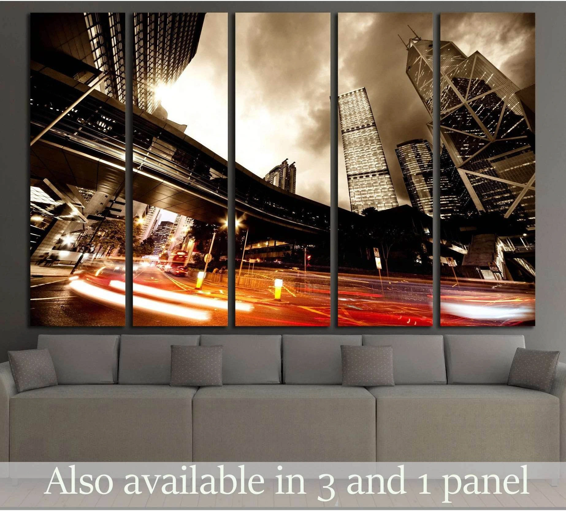 Sepia city traffic canvas print with red light trails beneath skyscrapers in a modern living room