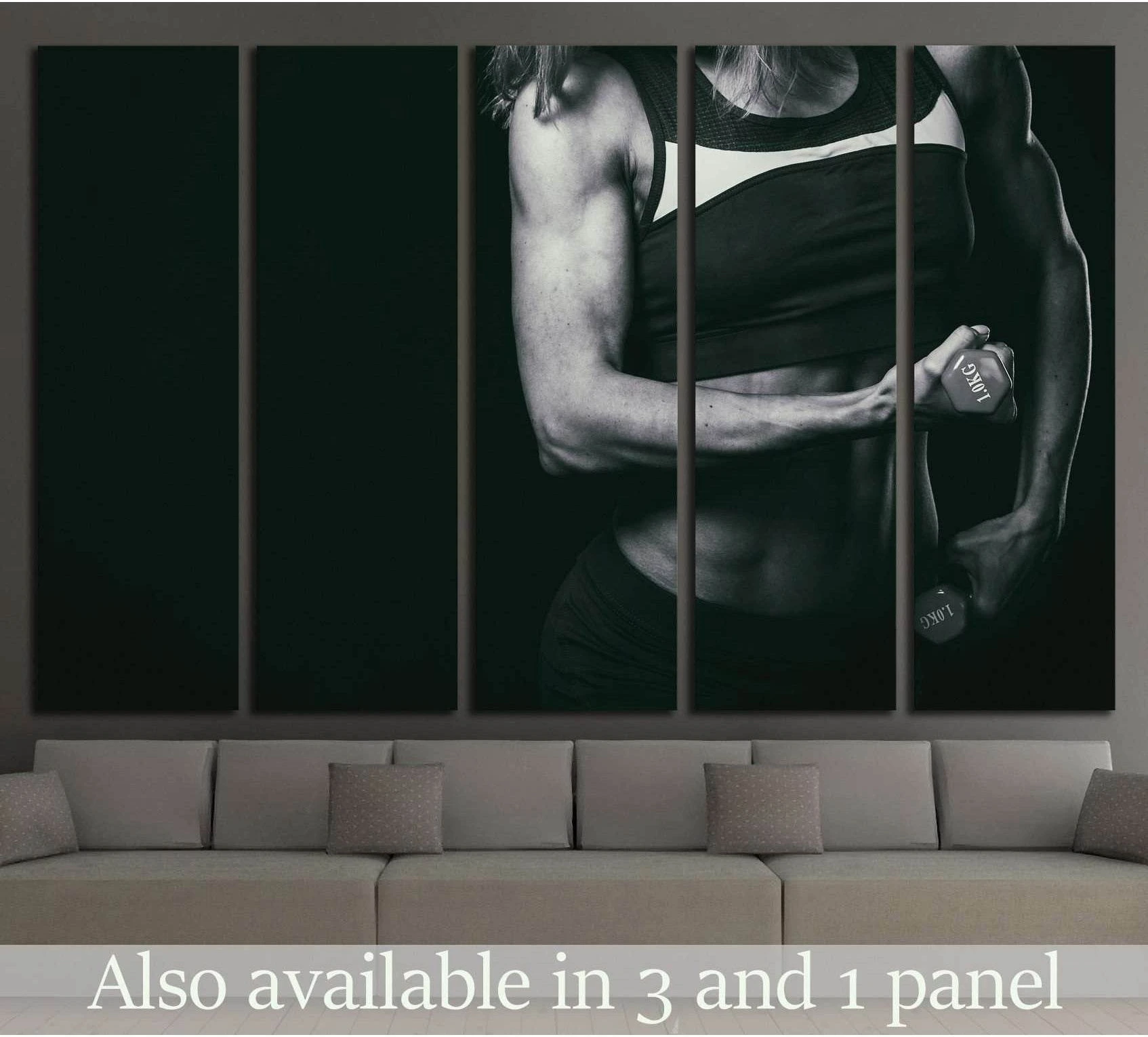 Black and white female fitness canvas print with cropped athlete holding dumbbells above sofa