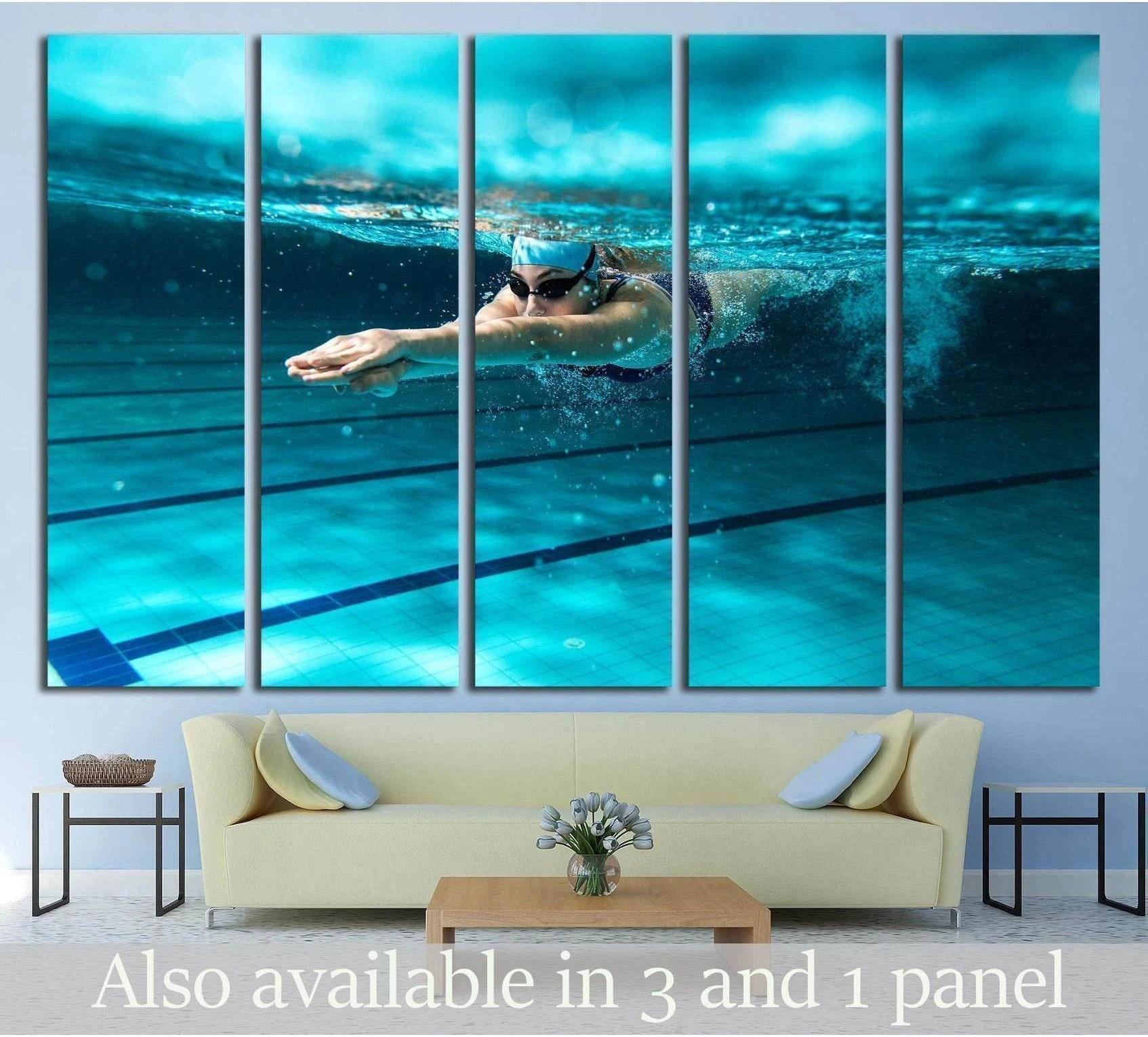Underwater female swimmer canvas print in a turquoise pool, displayed as multi-panel wall art above a sofa