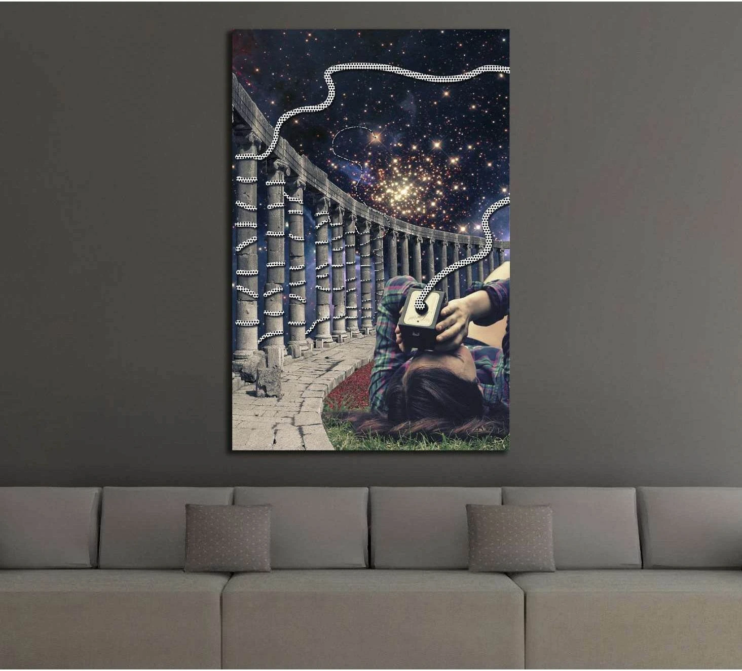 Surreal galaxy collage canvas print with classical columns, seated figure, and star-filled sky above a sofa