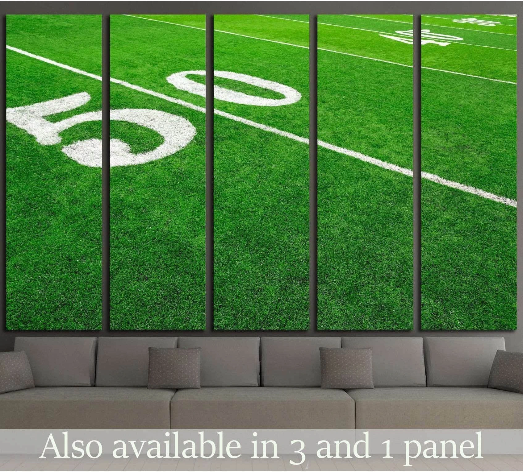 Football field canvas print showing the 50 yard line on green turf above a modern sofa