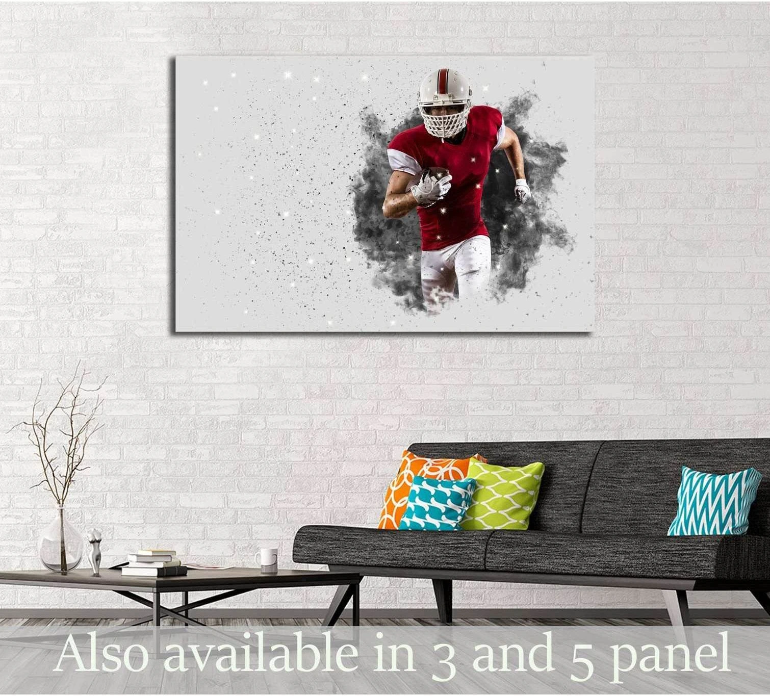 Football player canvas print with red uniform and smoke effect above a sofa in a modern living room