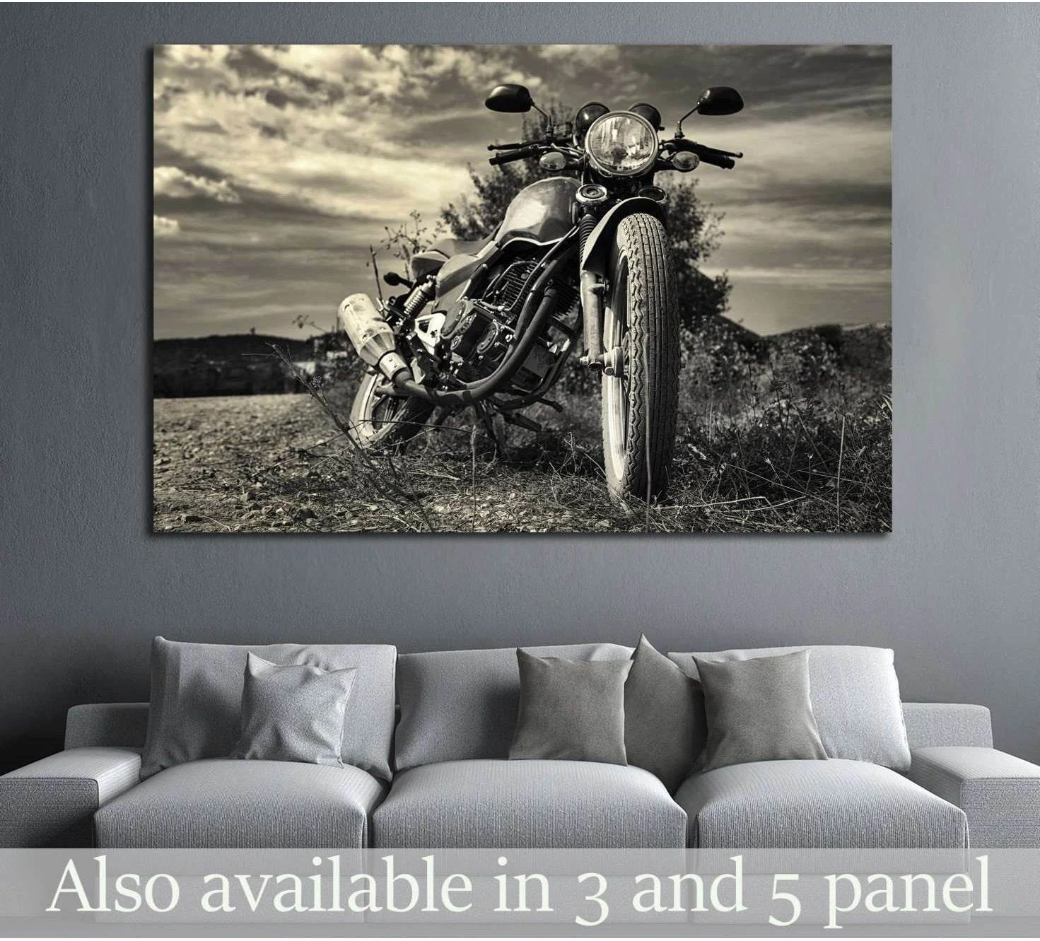 Sepia vintage motorcycle canvas print hung above a gray sofa in a modern living room