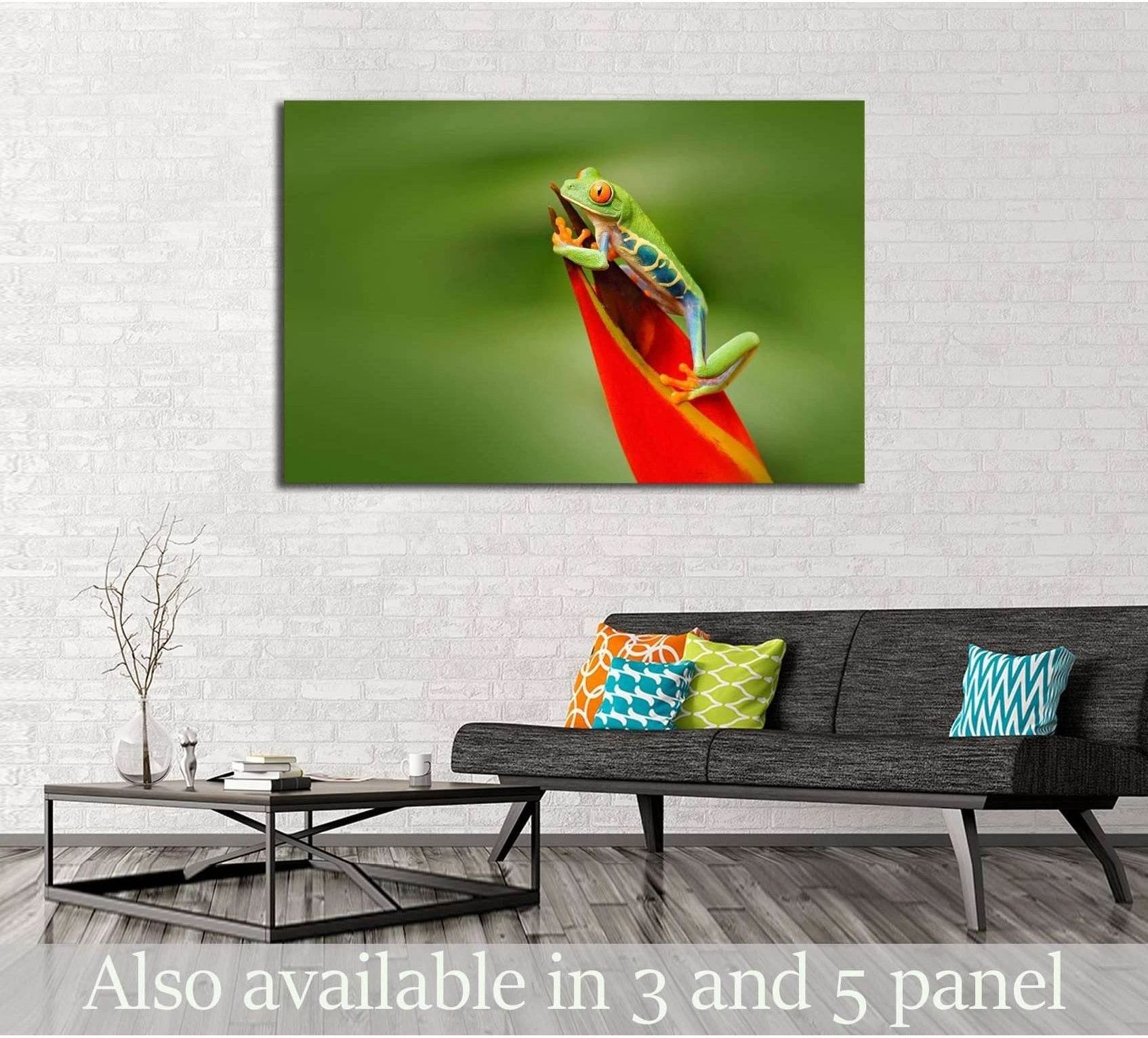 Red-eyed tree frog canvas print on a red tropical flower above a sofa in a modern living room