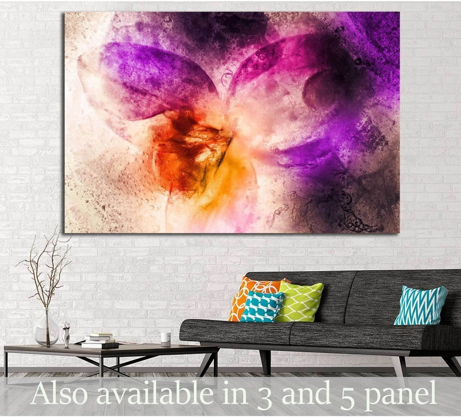 Abstract purple orchid canvas print with orange center hung above sofa in a modern living room