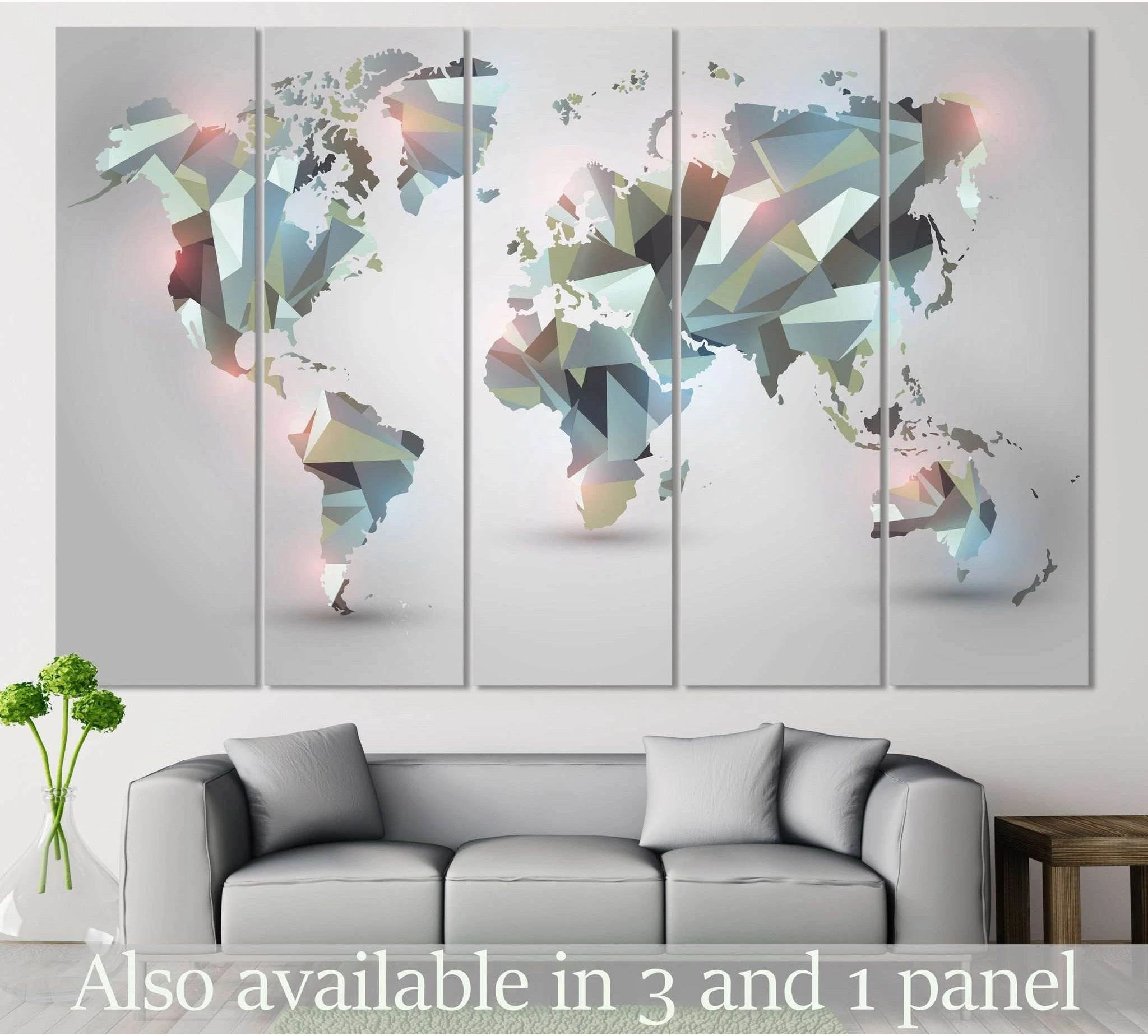 Geometric world map canvas print in pastel low-poly panels above a sofa in a modern living room