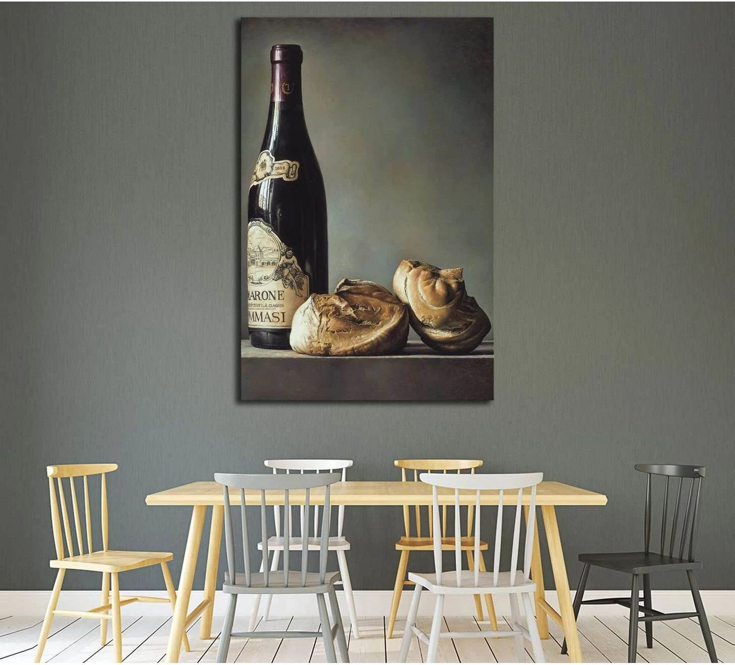 Bread and wine still life canvas print hung above a dining table in a minimalist dining room
