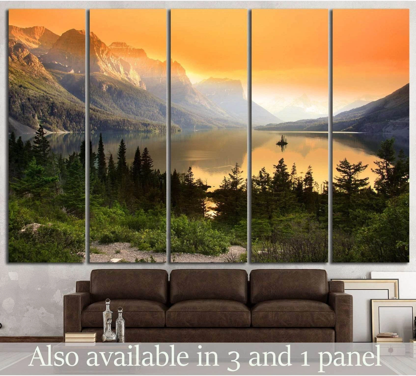 Glacier National Park mountain lake sunset canvas print hung above a sofa in a rustic living room
