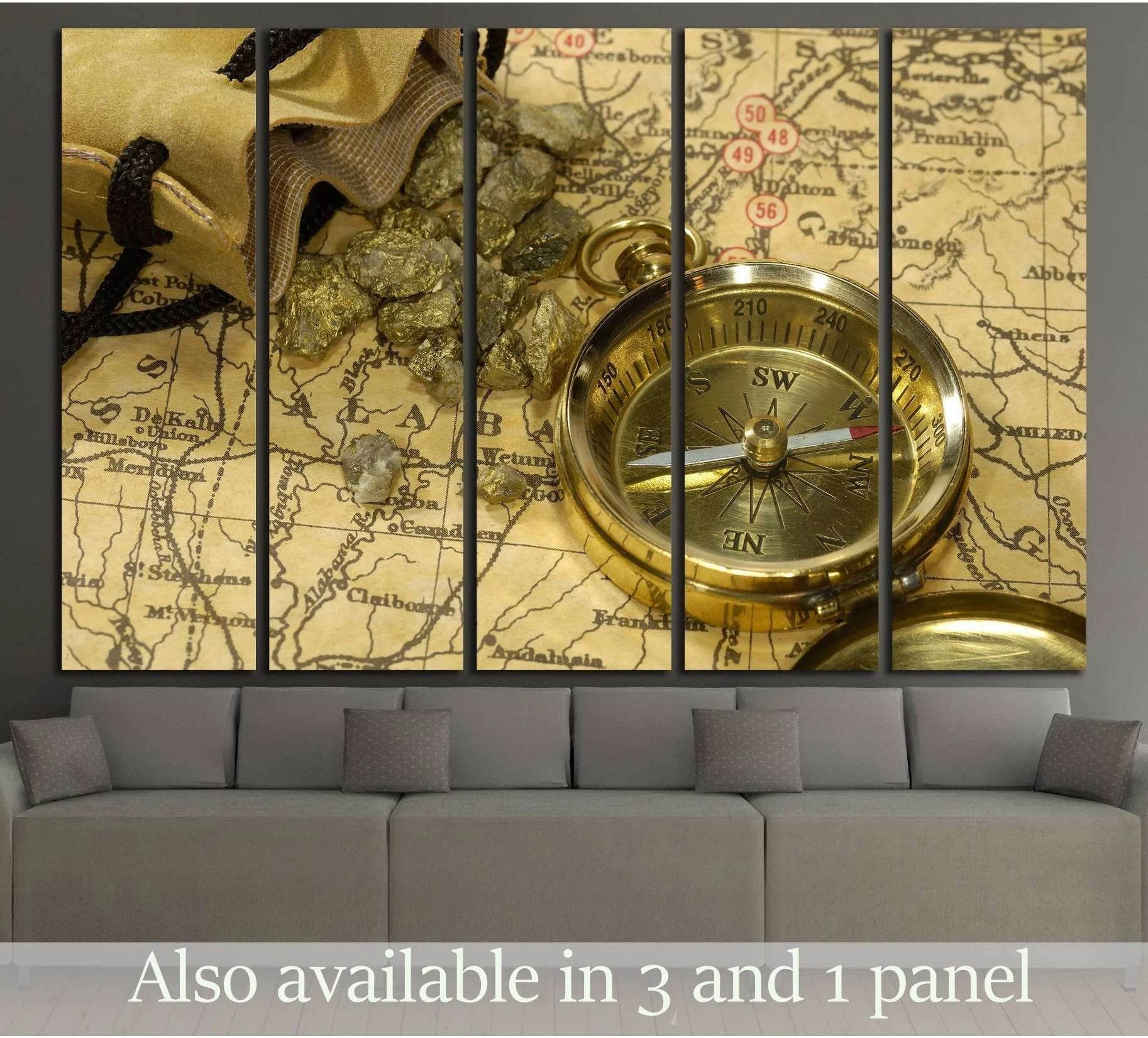 Vintage compass canvas print with antique map in warm gold tones, displayed above a gray sofa
