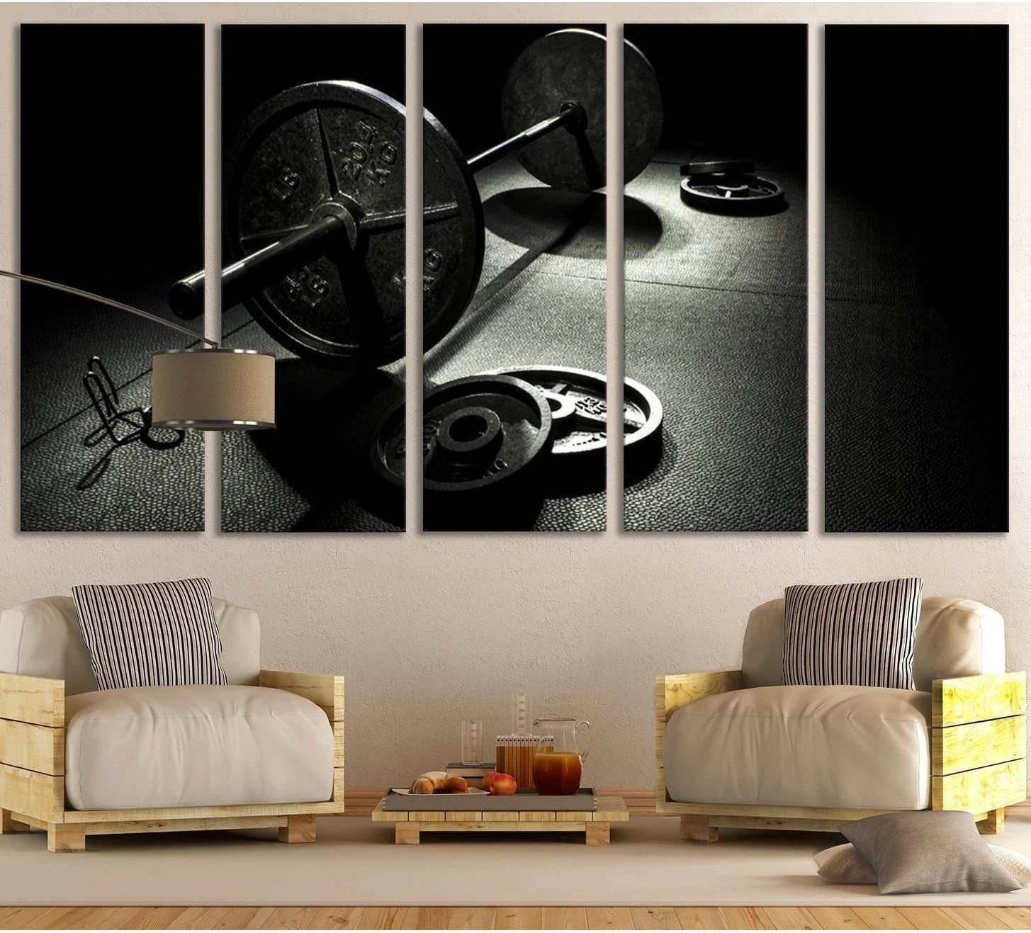 Black and white barbell canvas print hung above chairs in a modern room, featuring weight plates on a gym floor