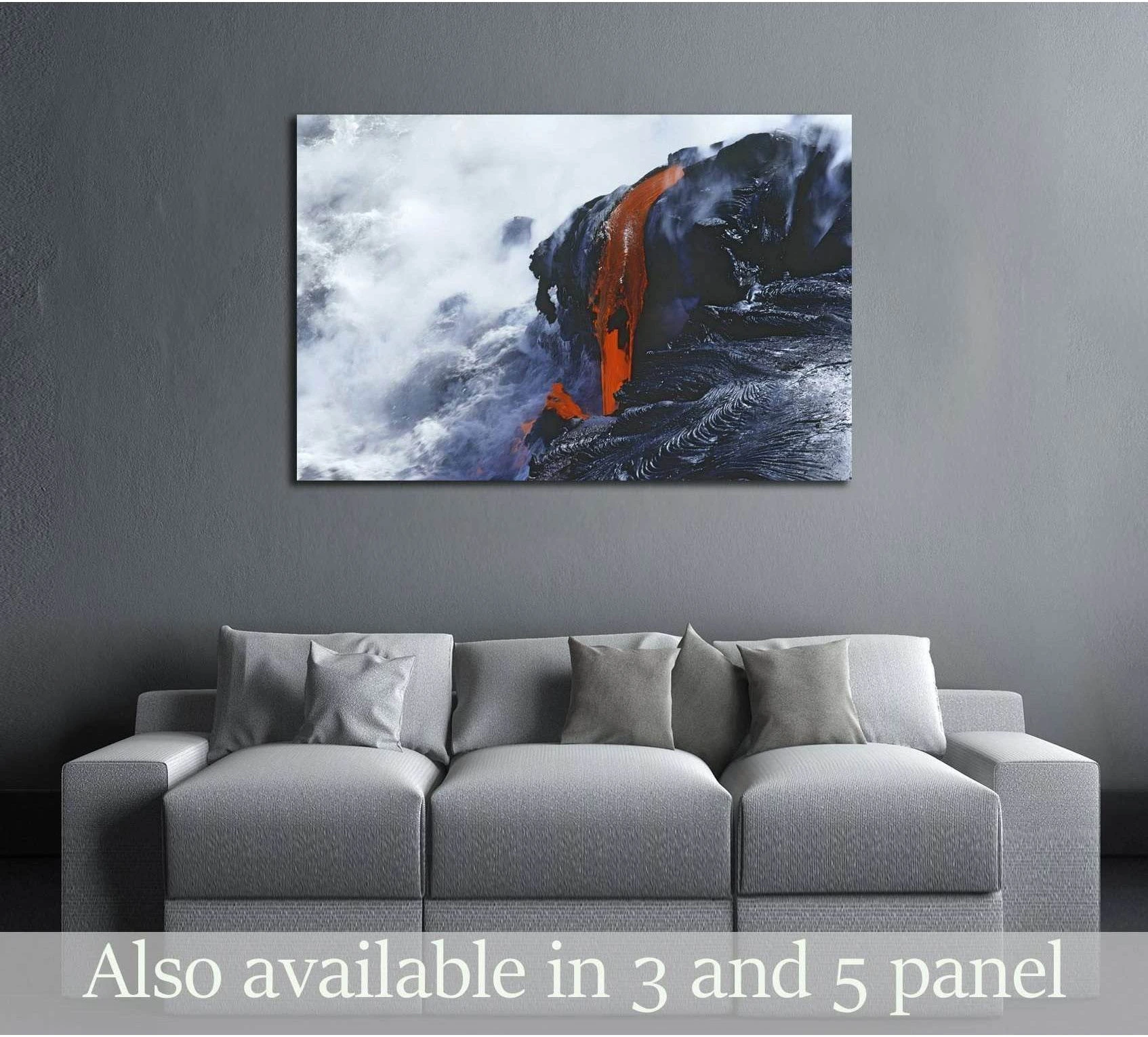 Hawaii lava flow canvas print above sofa in modern living room with black volcanic rock and steam