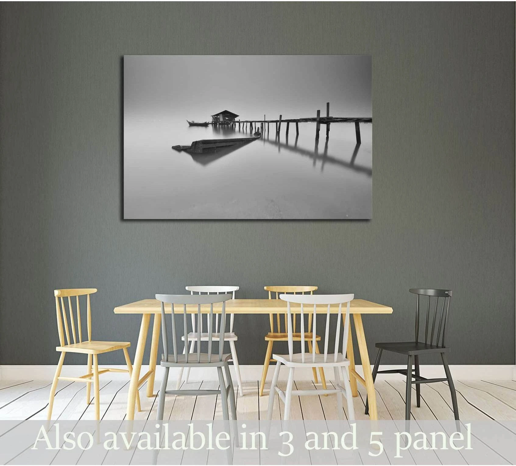 Black and white misty pier canvas print with boathouse above a dining table in a modern room