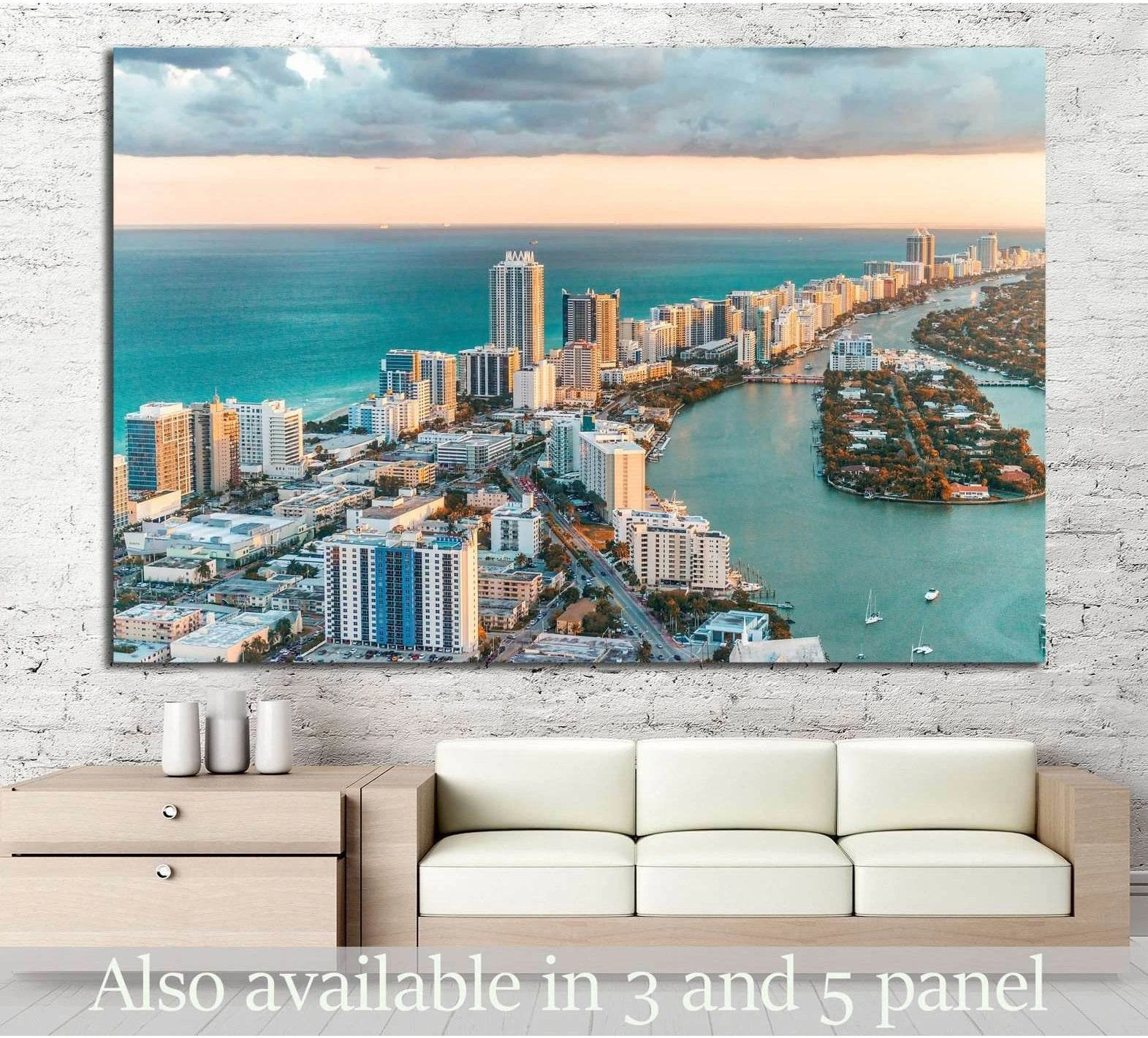 Aerial Miami South Beach canvas print with teal ocean and skyline, displayed above sofa