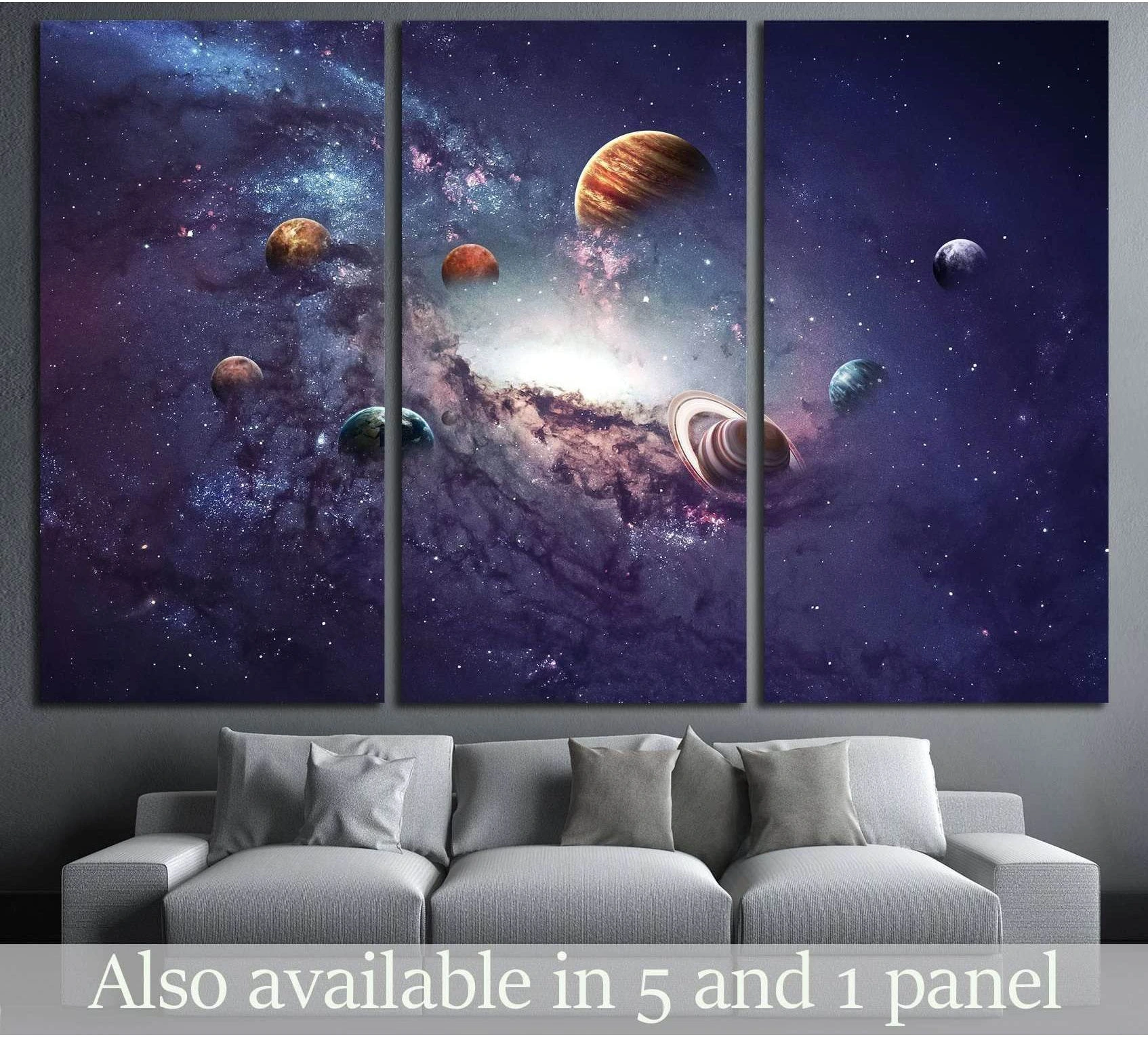 Solar system planets triptych canvas print above a sofa in a modern living room