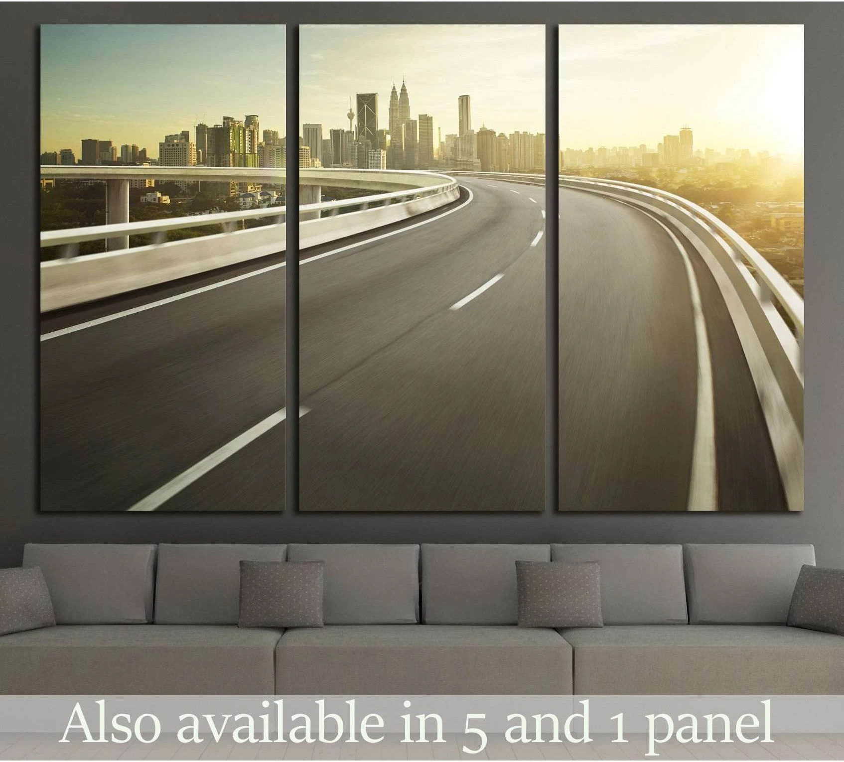 Triptych urban highway canvas print with curved overpass and hazy city skyline above sofa