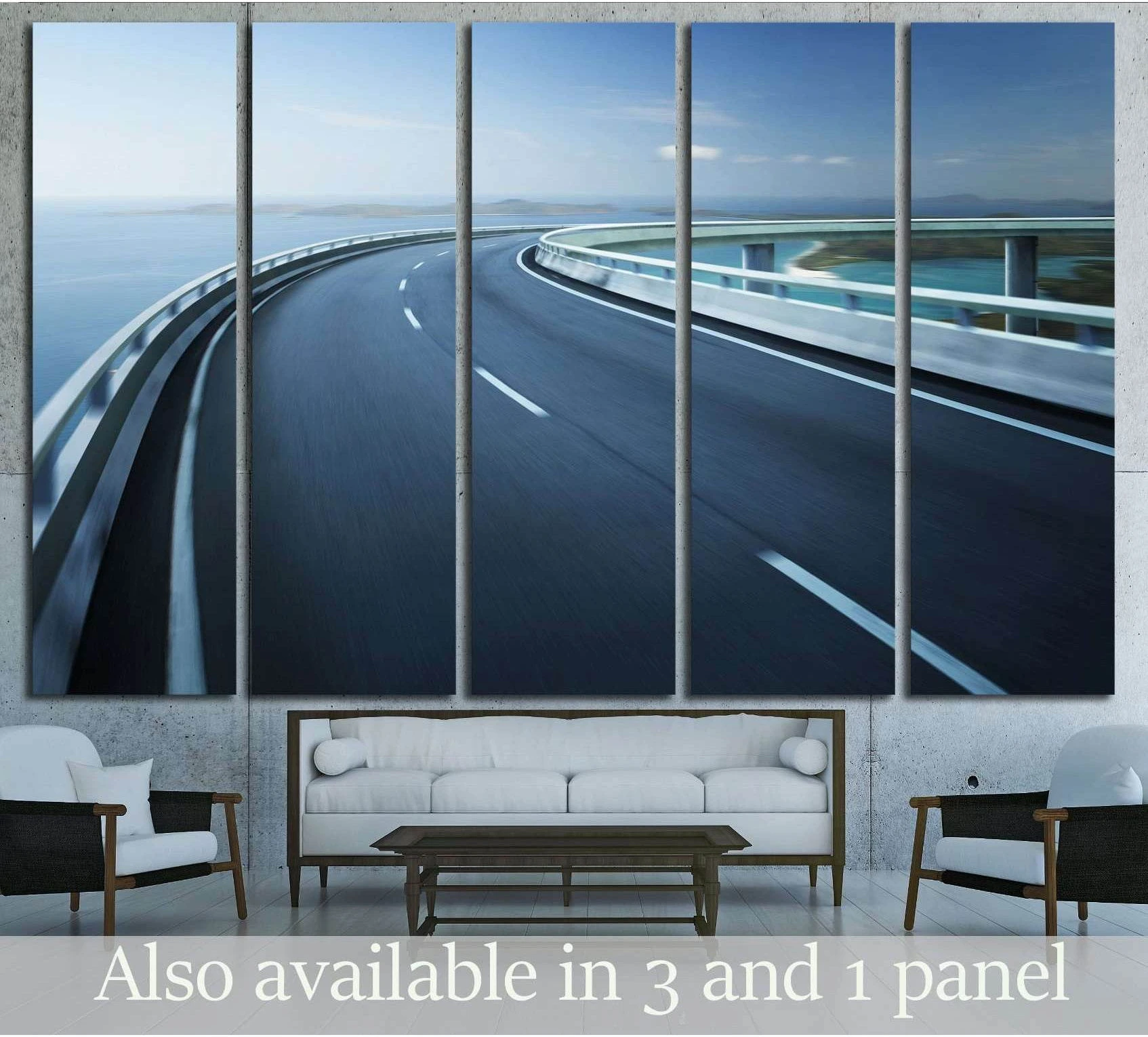 Curved coastal highway canvas print above sofa in a modern living room with blue ocean backdrop