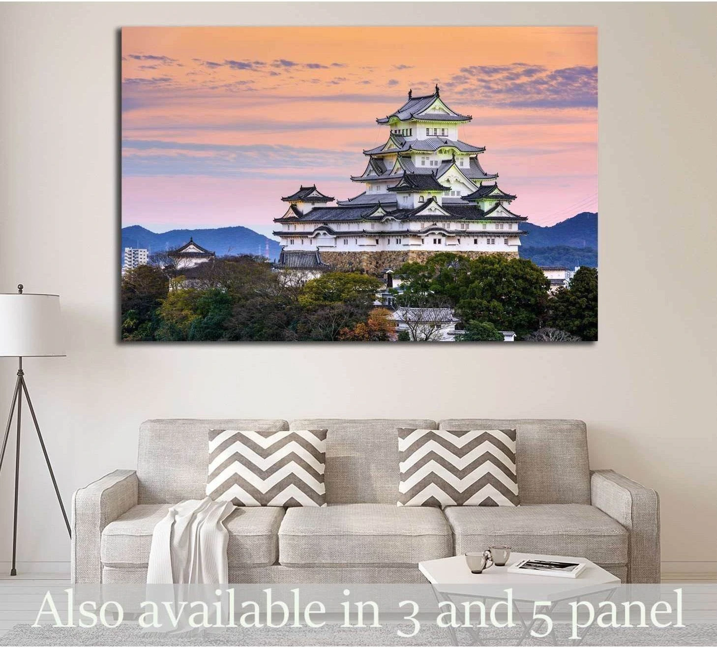 Himeji Castle canvas print above a sofa in a neutral living room with pastel sunset sky