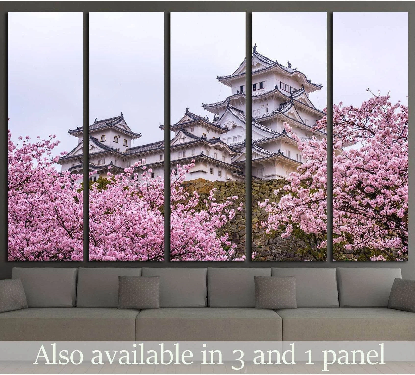 Himeji Castle canvas print with pink sakura blossoms above a sofa in a modern living room