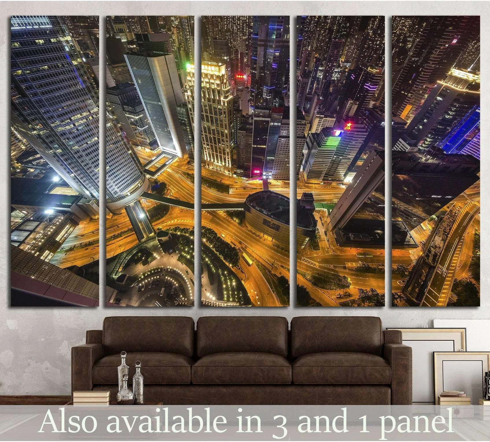 Hong Kong night skyline canvas print with aerial skyscrapers and glowing roads above a sofa