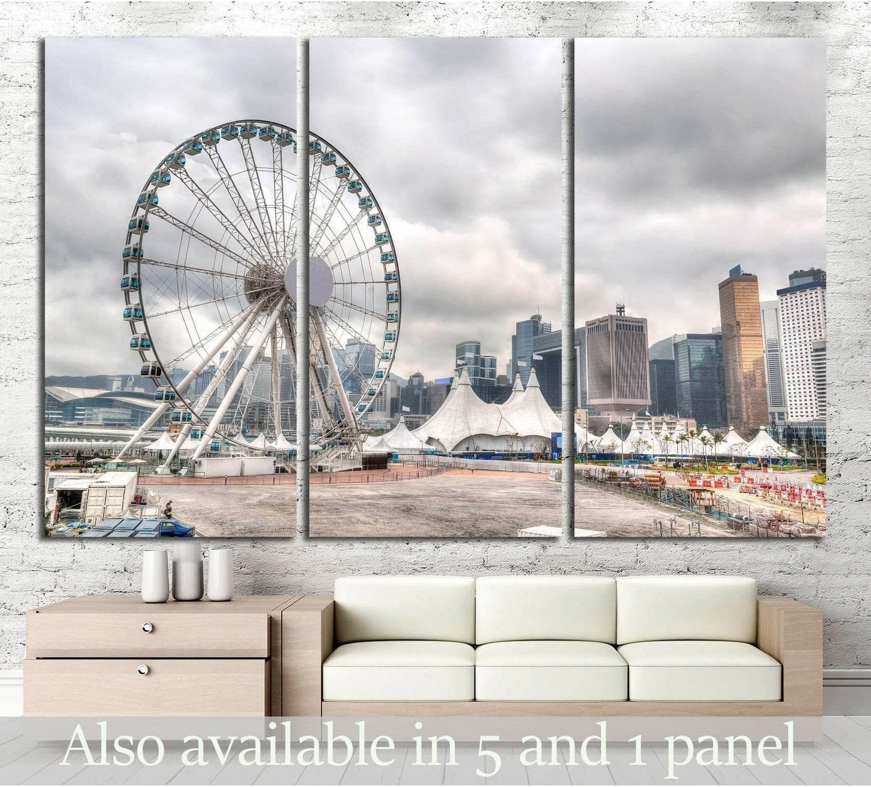 Hong Kong skyline canvas print with Central Pier Ferris wheel above a sofa in a modern living room