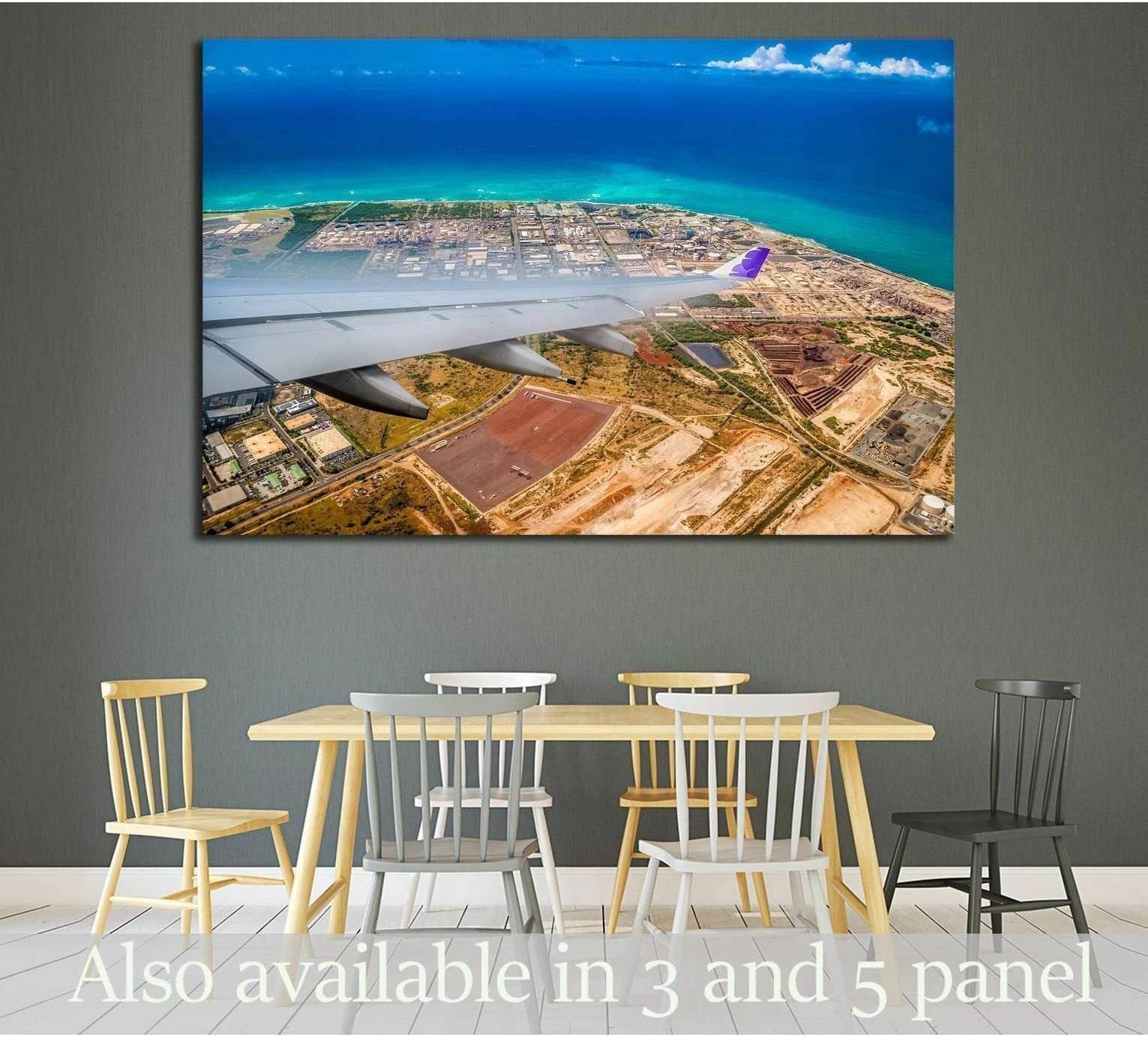 Honolulu aerial canvas print with plane wing over turquoise coast, displayed above a dining table