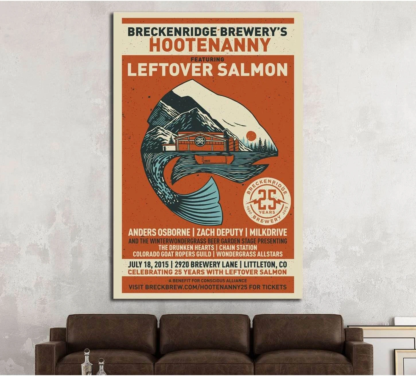 Vintage Hootenanny poster canvas print with mountain, river, and train above a brown sofa