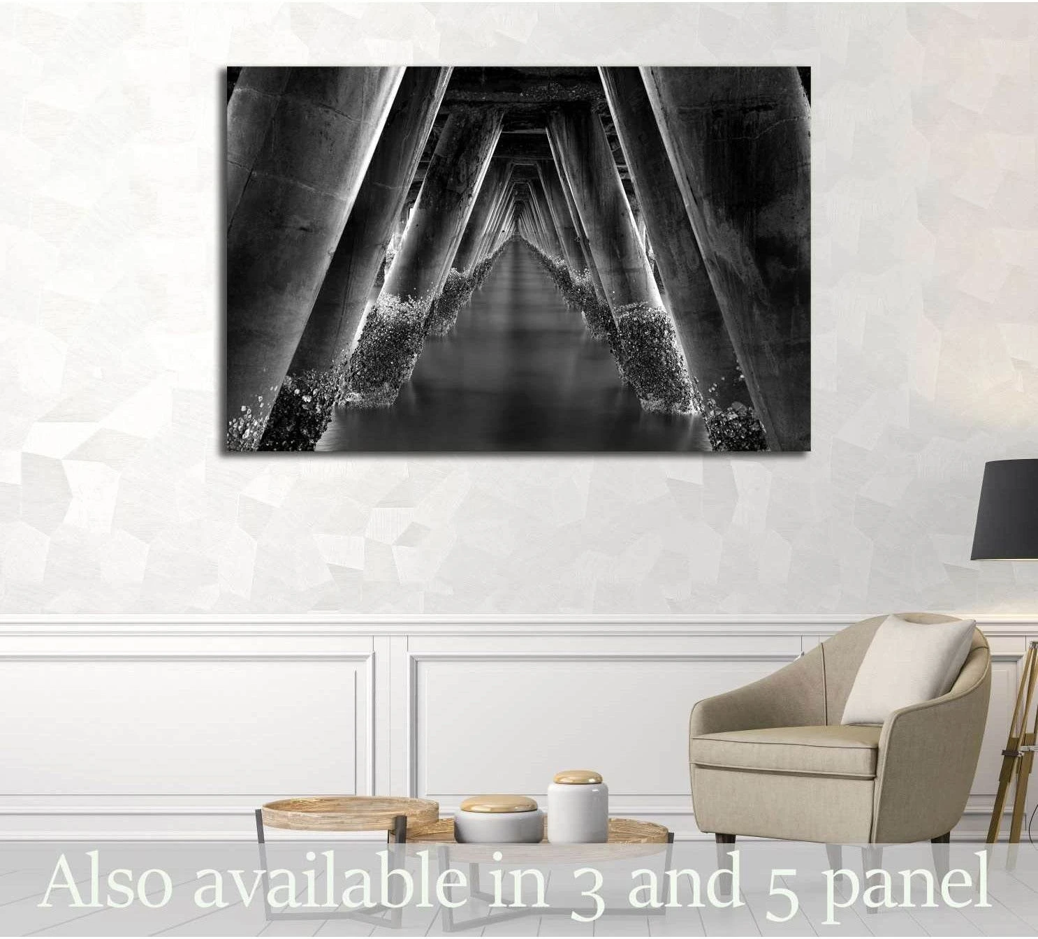 Black and white pier canvas print with repeating pilings, displayed in a modern neutral living room