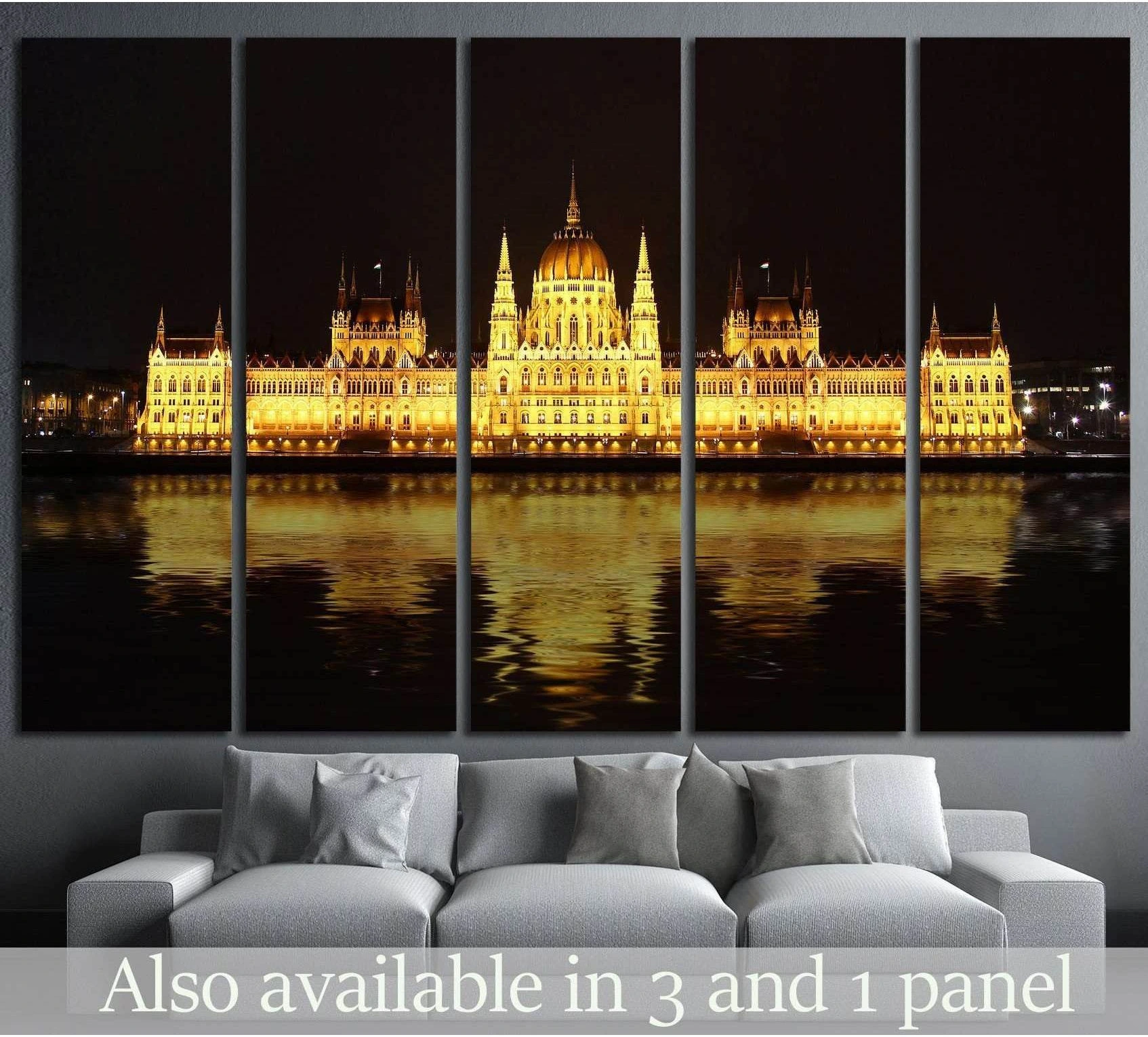 Budapest Parliament canvas print glowing at night above sofa in a modern living room