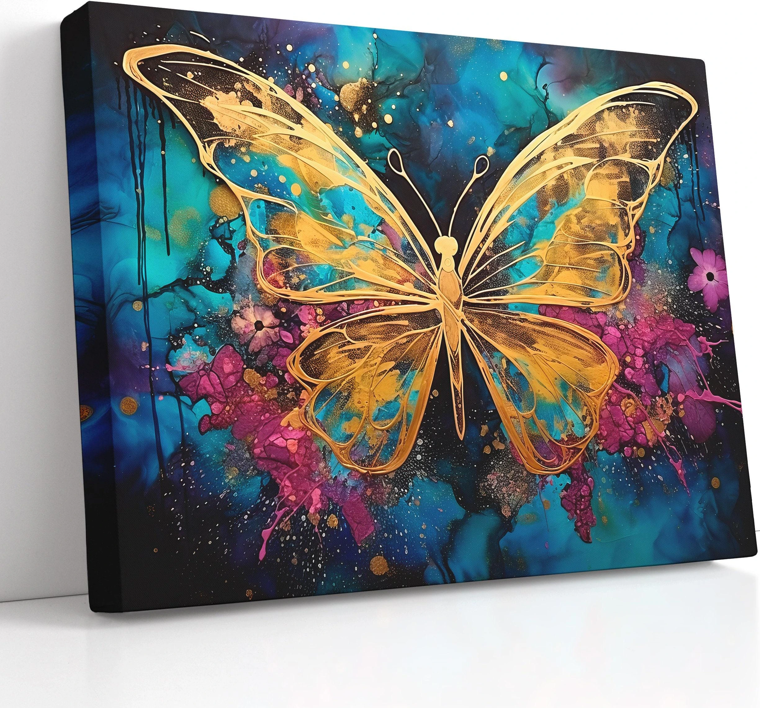 Abstract gold butterfly on a teal, blue and magenta splash background with glitter-like speckles