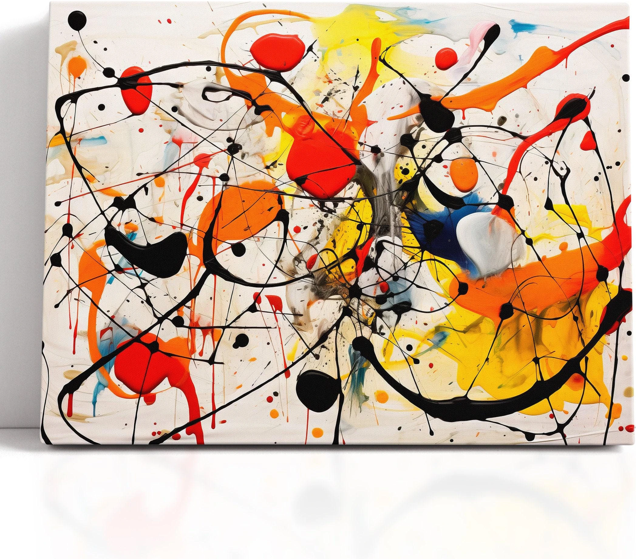Abstract splatter artwork with black looping lines and red, orange, yellow and blue paint bursts on a white background detail view