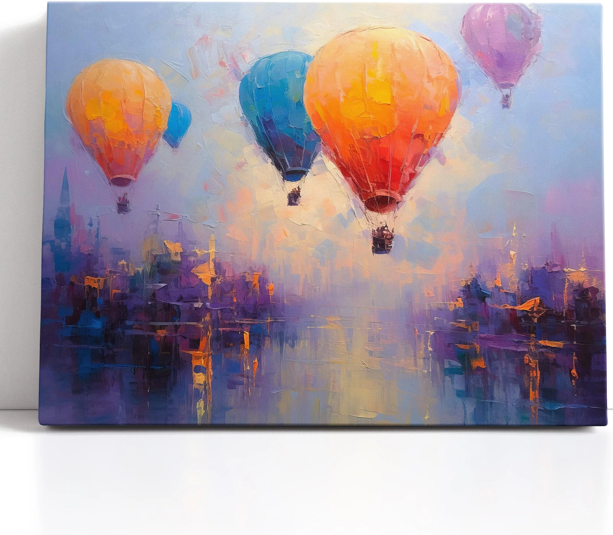 Three colourful hot air balloons floating above a stylised city at sunset detail view