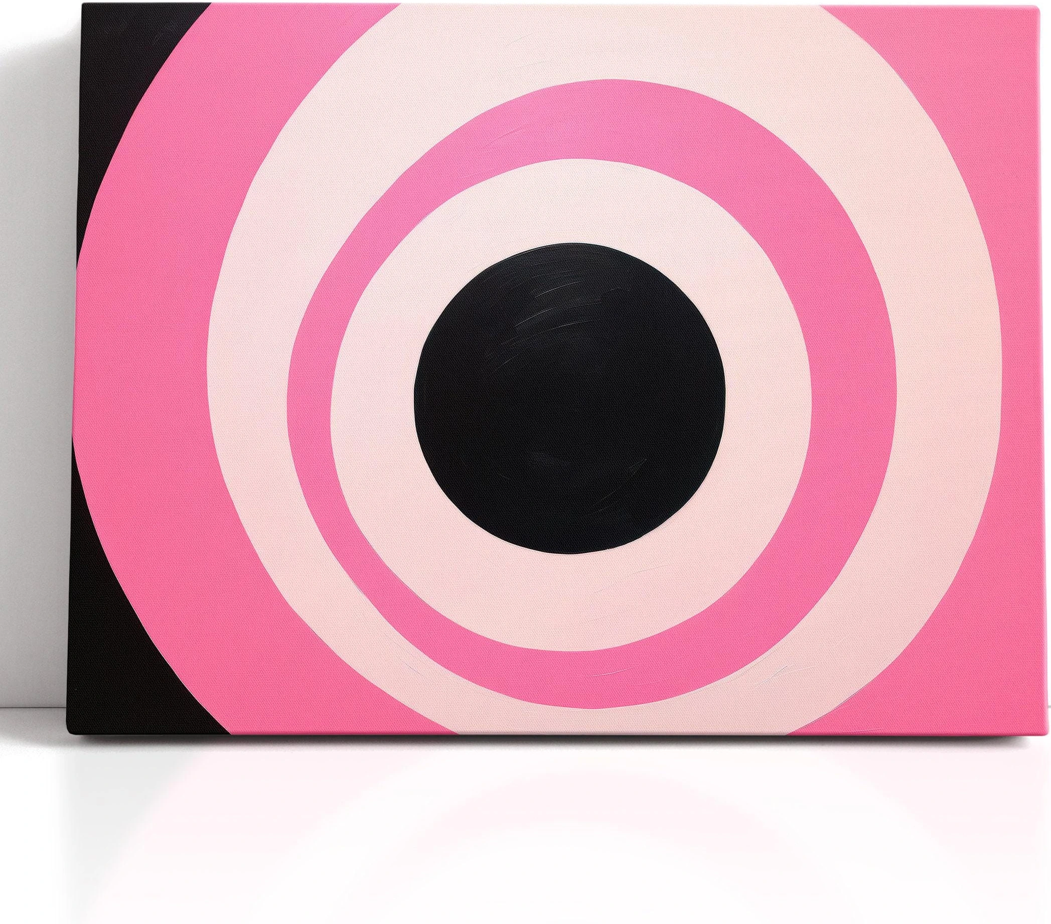 Hot pink and black concentric circles geometric artwork with pale ivory rings detail view