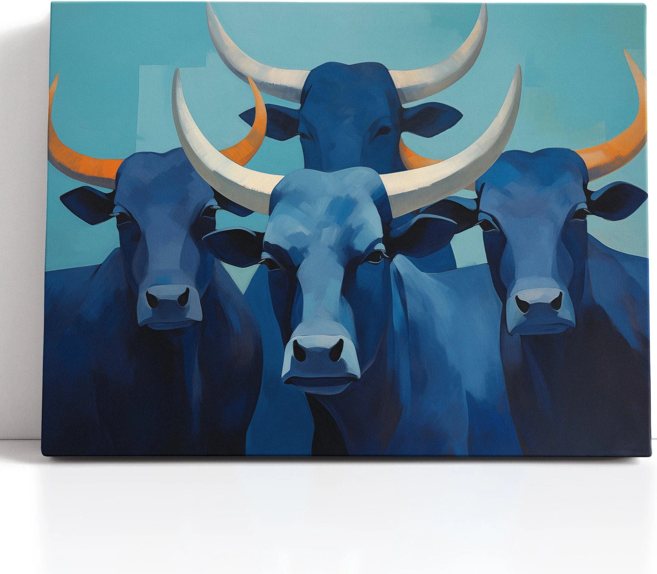 Blue longhorn herd artwork with three cattle heads and curved horns in teal and orange accents detail view