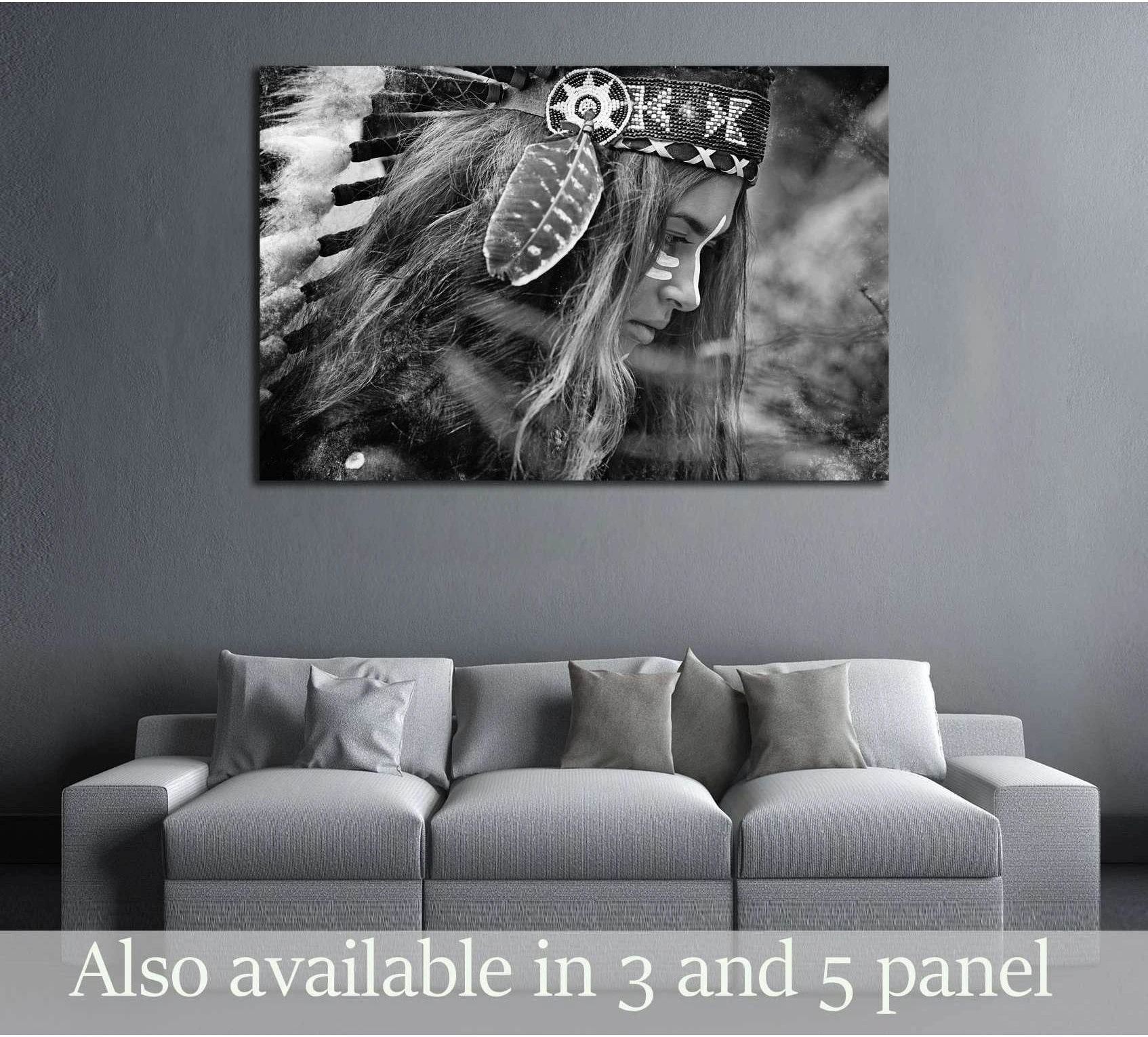 Black and white woman portrait canvas print with feather headdress above sofa