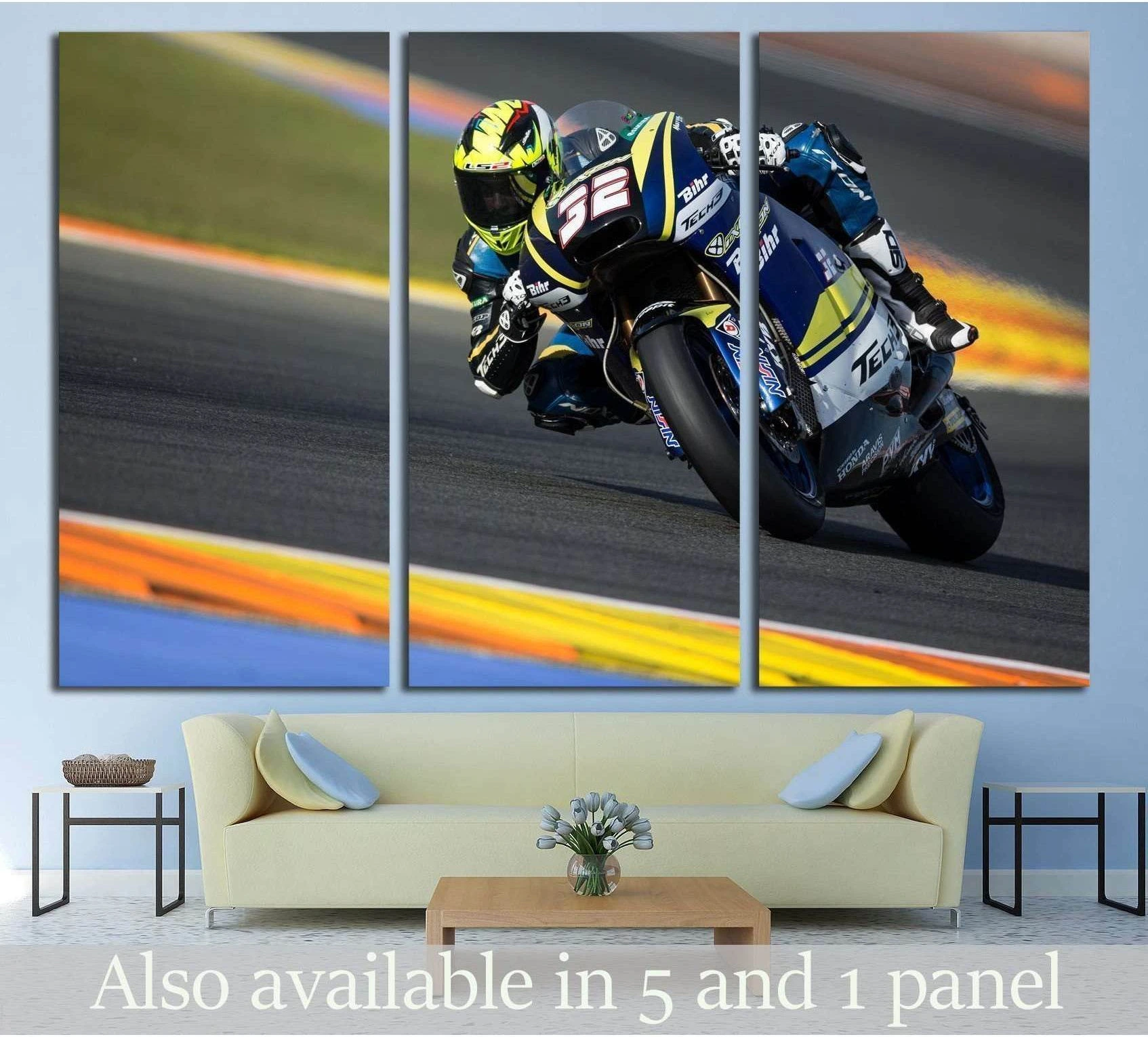MotoGP rider leaning into a turn canvas print triptych above sofa in a modern living room