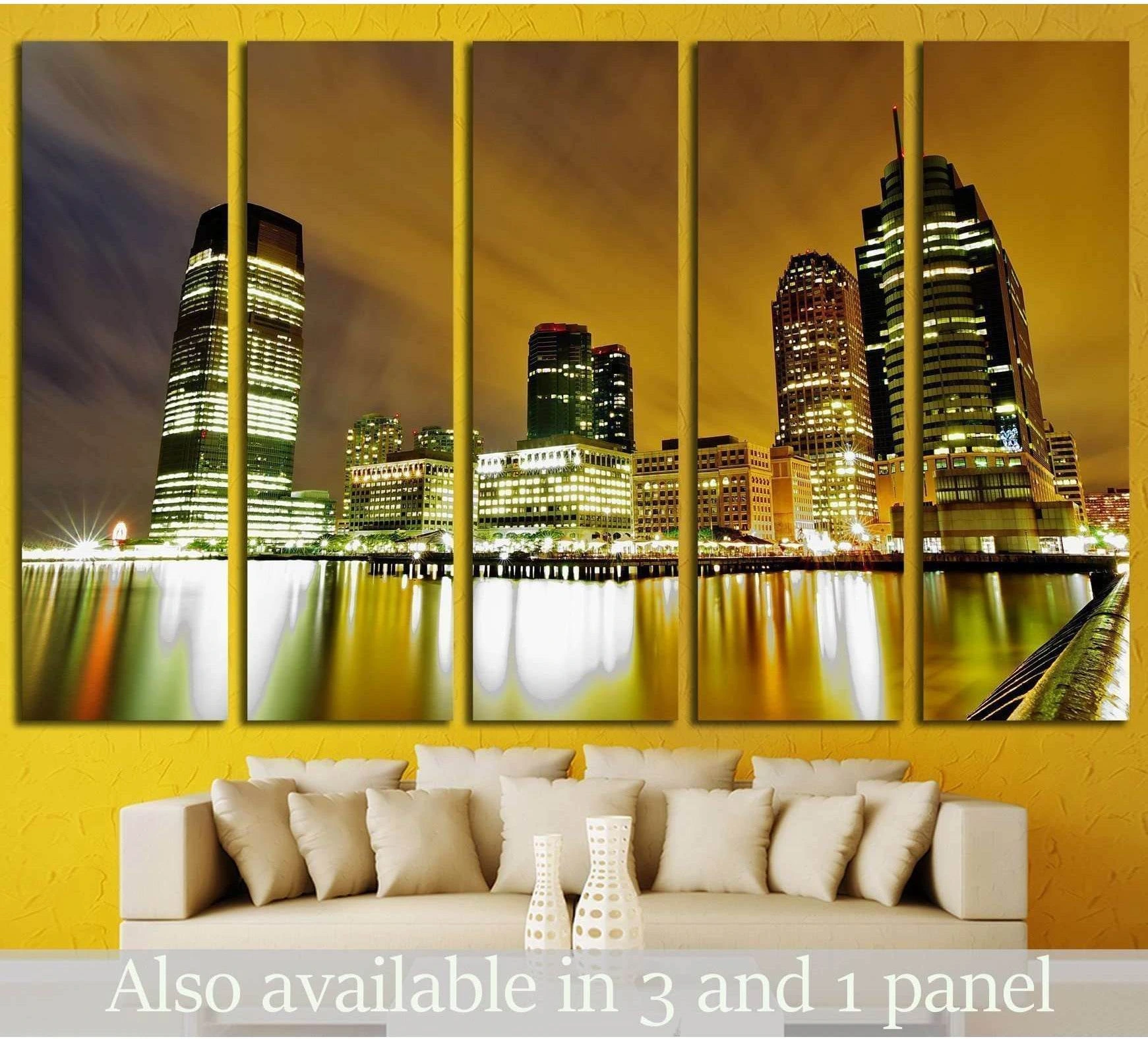 Jersey City skyline canvas print with golden night reflections above a sofa in a modern living room